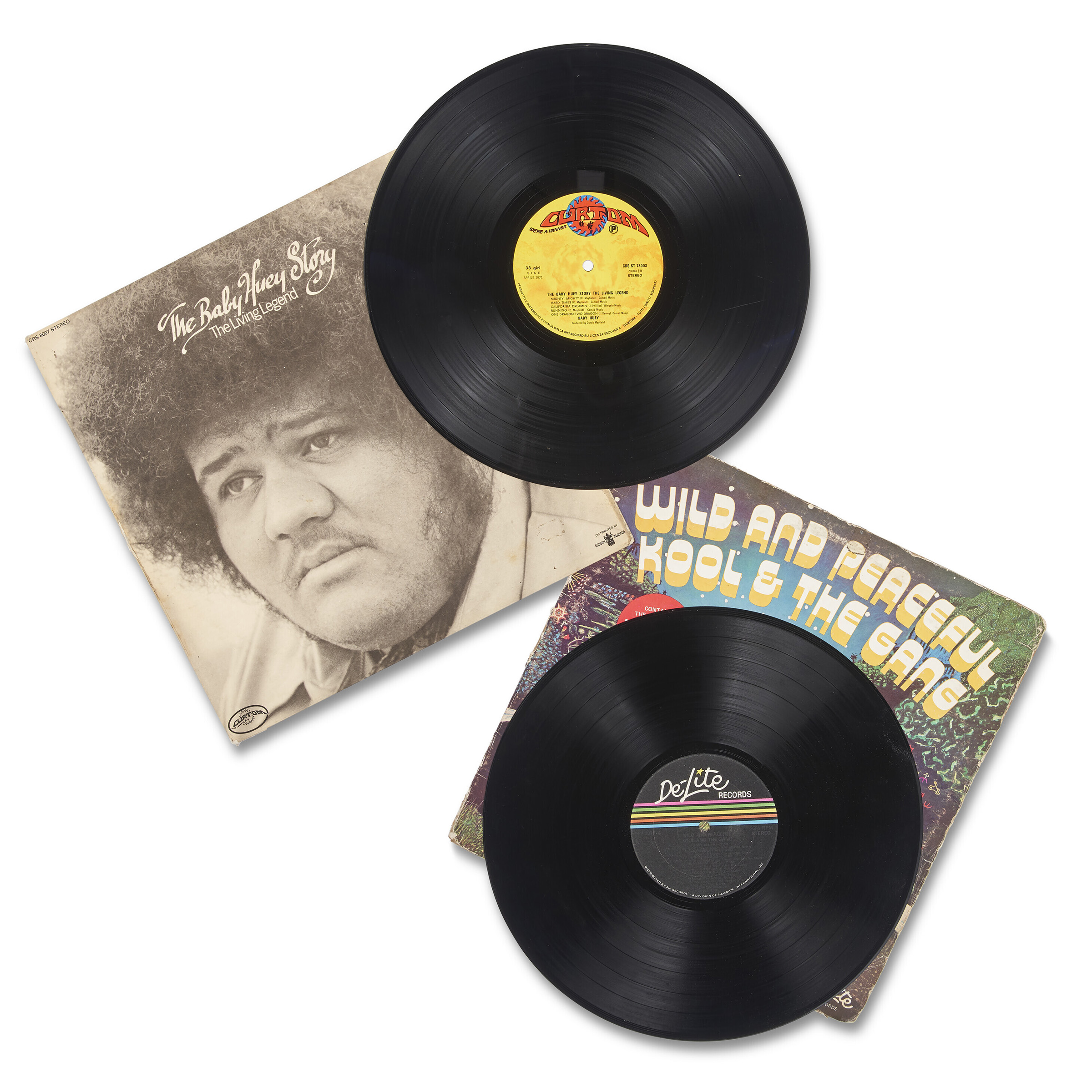 Left: Living Legend, Baby Huey, 1971. Vinyl Record. U.S.: Released by Curtom Records. Right: Wild and Peaceful, Kool & The Gang, 1973. Vinyl Record. U.S.: Released by De-Lite Records. Sold as part of 'The Rec Room Dozen' for $8,190 in DJ Kool Herc & the Birth of Hip-Hop on 18 August 2022 at Christie's Online