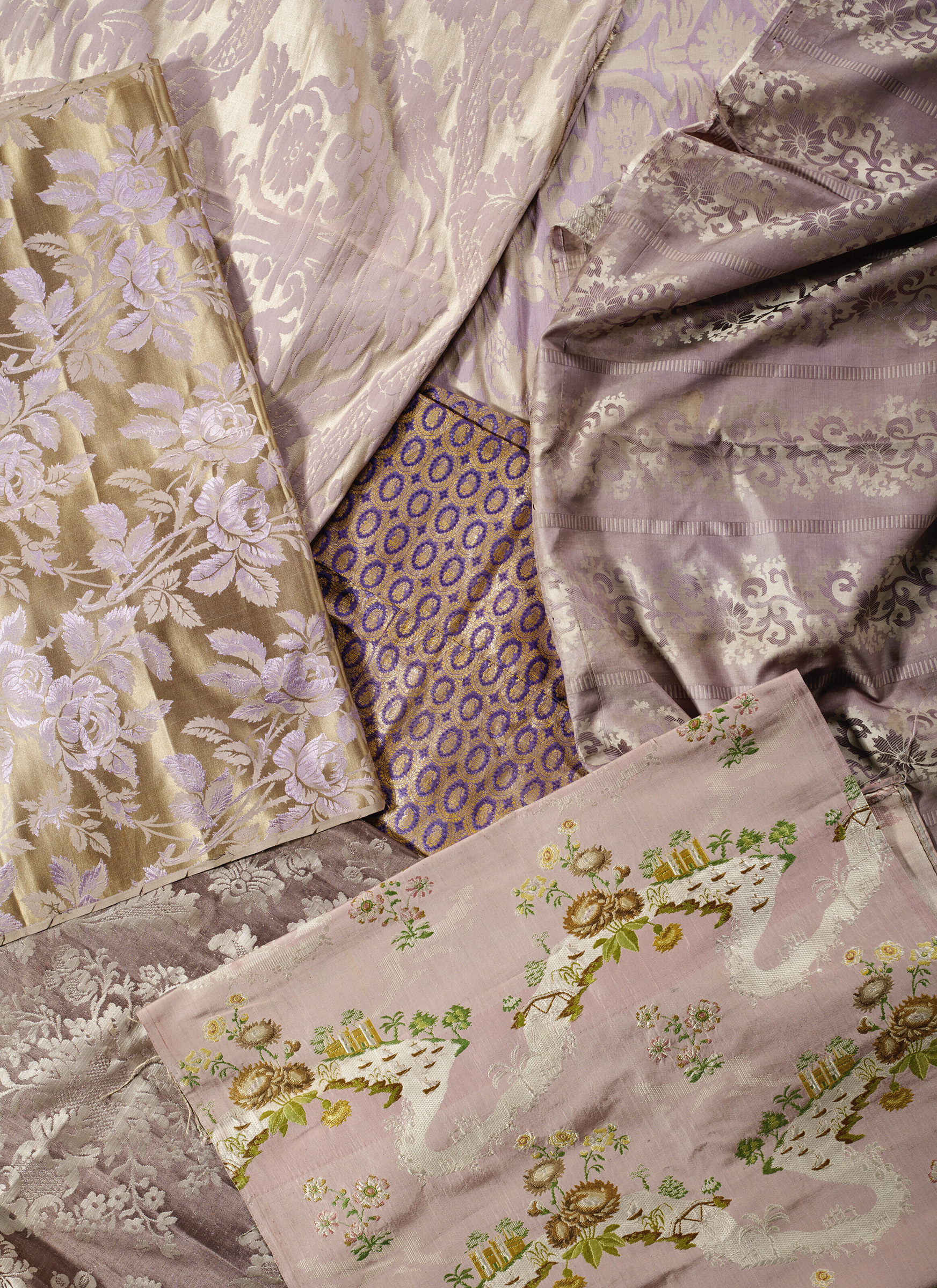 A group of eight mauve toned silks, English, Continental and Indian, 18th-20th century. 23 in (58.4 cm) wide, 76 in (193 cm) long. Sold for $882 in The Ann & Gordon Getty Collection: English and European Decorative Arts on 25 October 2022 at Christie’s Online