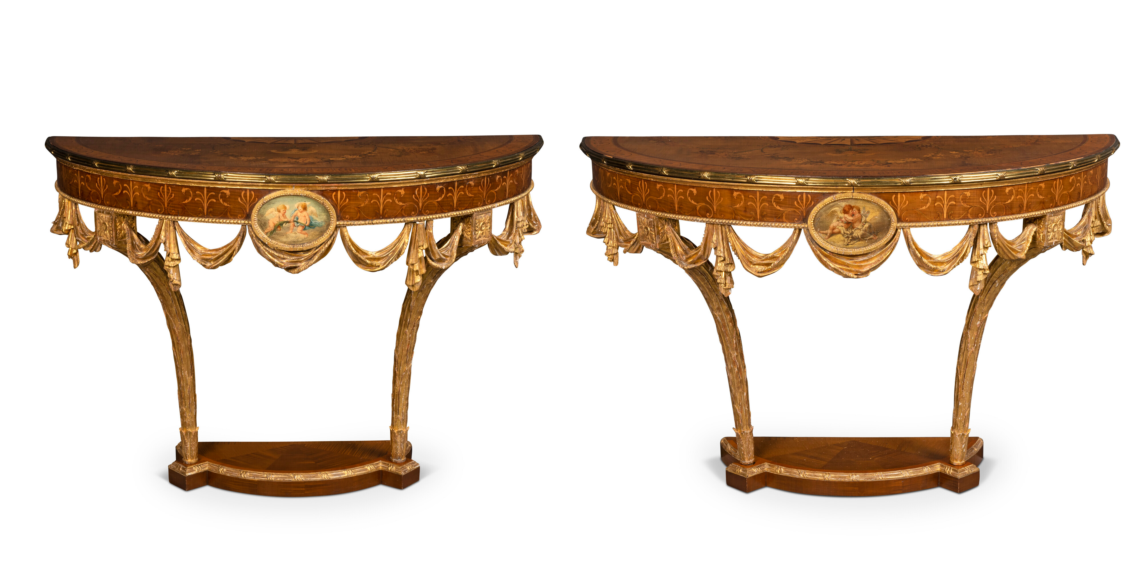 A pair of George III gilt-brass mounted marquetry, painted and giltwood demi-lune console tables, circa 1770. Attributed to William Ince and John Mayhew. 33&frac12; in (85 cm) high; 51&frac34; in (131.5 cm) and 47&frac34; in (121.3 cm) wide; 23&frac34; in (60.5 cm) deep.