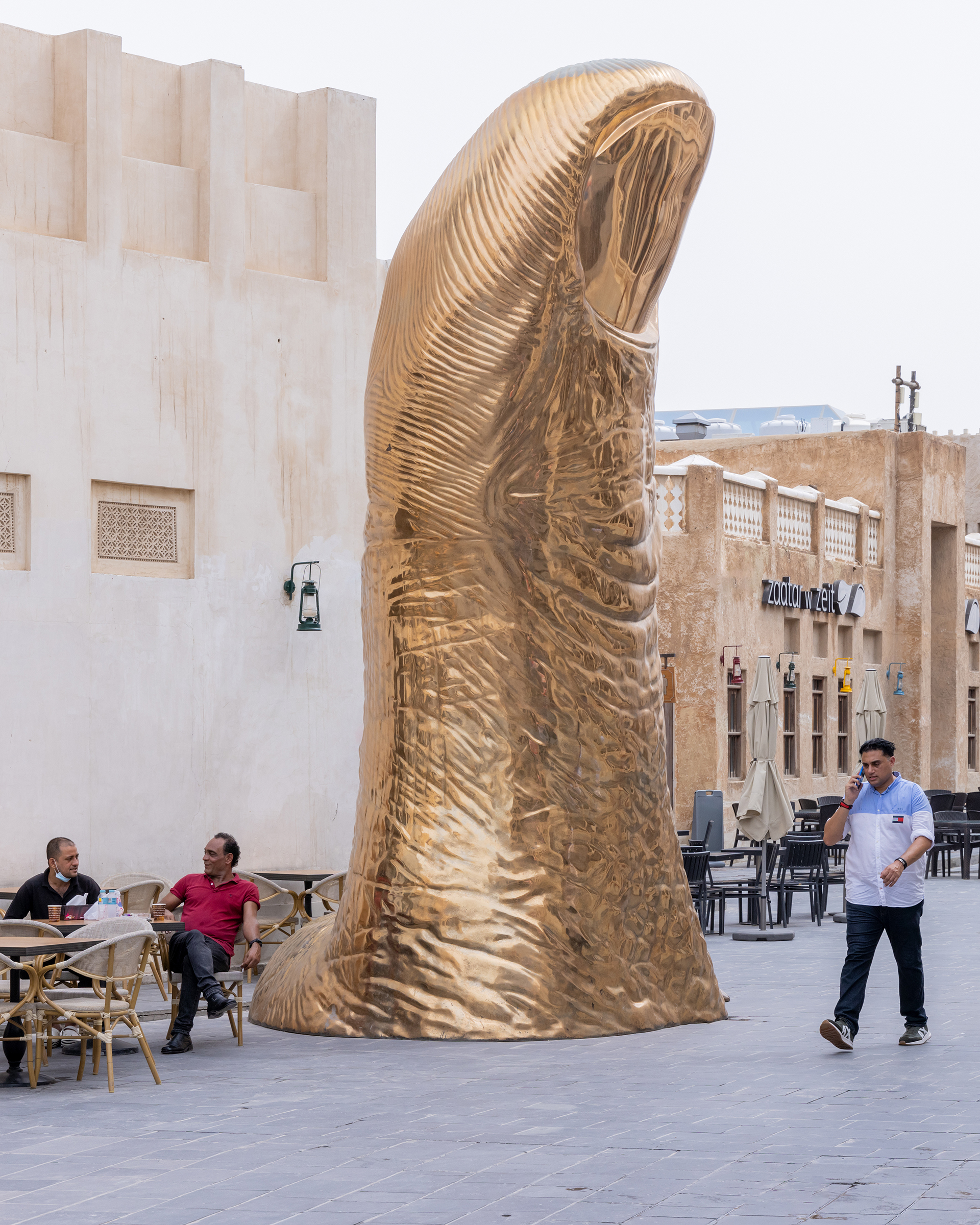 César Baldaccini (1921-1998), Le Pouce (Thumb), 1965-2016. Bronze with gold patina. Installation view, Souq Waqif. Photo: © Iwan Baan. Courtesy Qatar Museums
