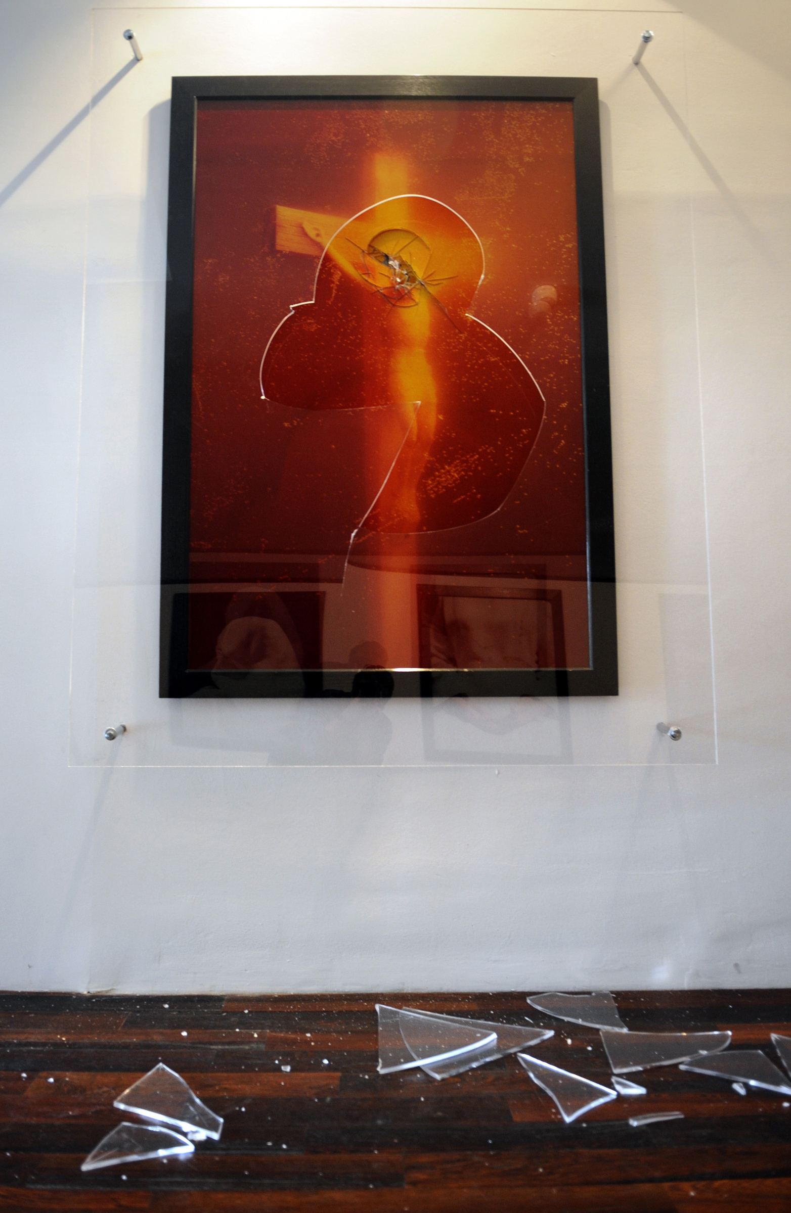 Andres Serrano's Piss Christ after being vandalised on 17 April 2011 at The Collection Lambert, Avignon. Photograph Boris Horvat via Getty Images