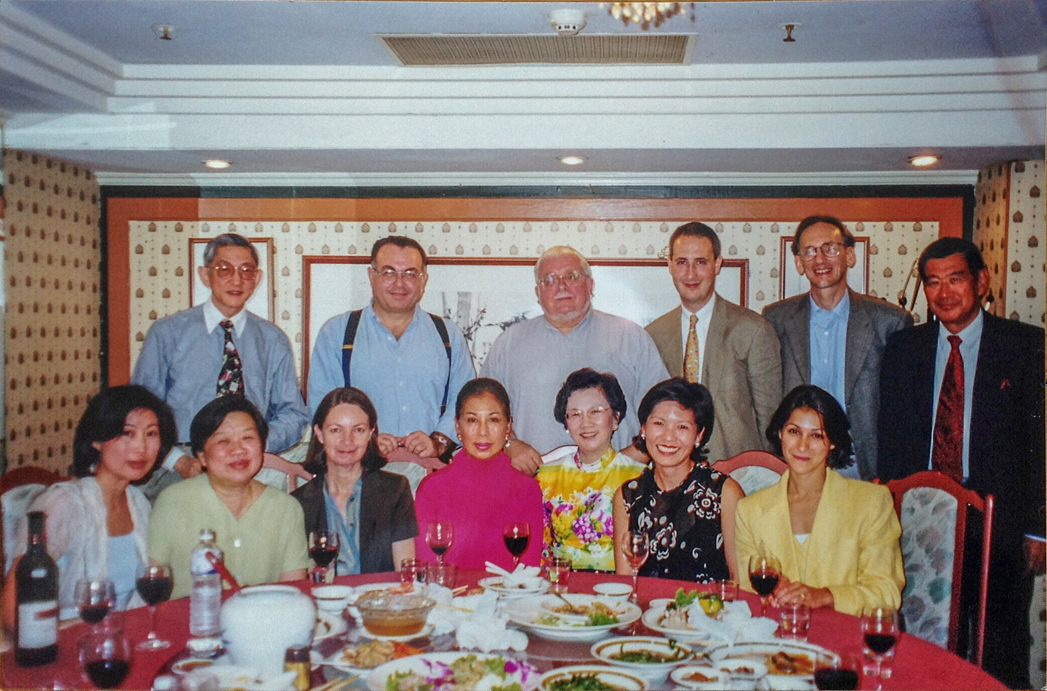 Gathering after the exhibition opening Splendor of Style: Classical Furniture from the Ming and Qing Dynasties in 1999. Front row left to right: Grace Wu Bruce, Alice Piccus, Sarah Evarts, Lana Kinoshita, Mrs. Man Tong Su Yip, Piper Tseng, Debbie Flacks. Back Row left to right: Dr. S. Y. Yip, Malcom Riddell, Robert Piccus, Marcus Flacks, Curtis Evarts, Jim Kinoshita
