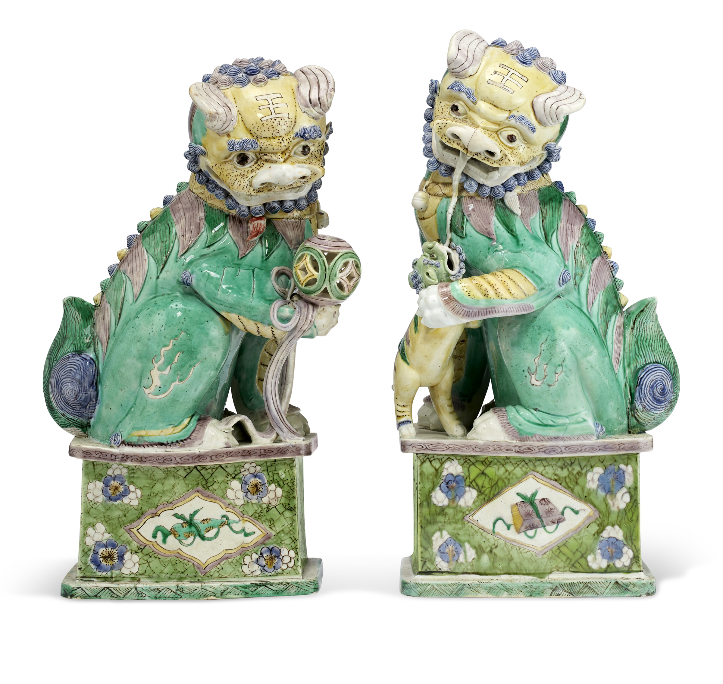 A pair of Chinese porcelain famille verte Buddhist lions Kangxi Period, 1662-1722. 17&frac14;  in (43.7 cm) high. Estimate: $10,000-15,000. Offered in The Collection of Pierre Durand on 27 January 2022 at Christie&rsquo;s New York. Offered in The Collection of Pierre Durand on 27 January 2022 at Christie&rsquo;s New York