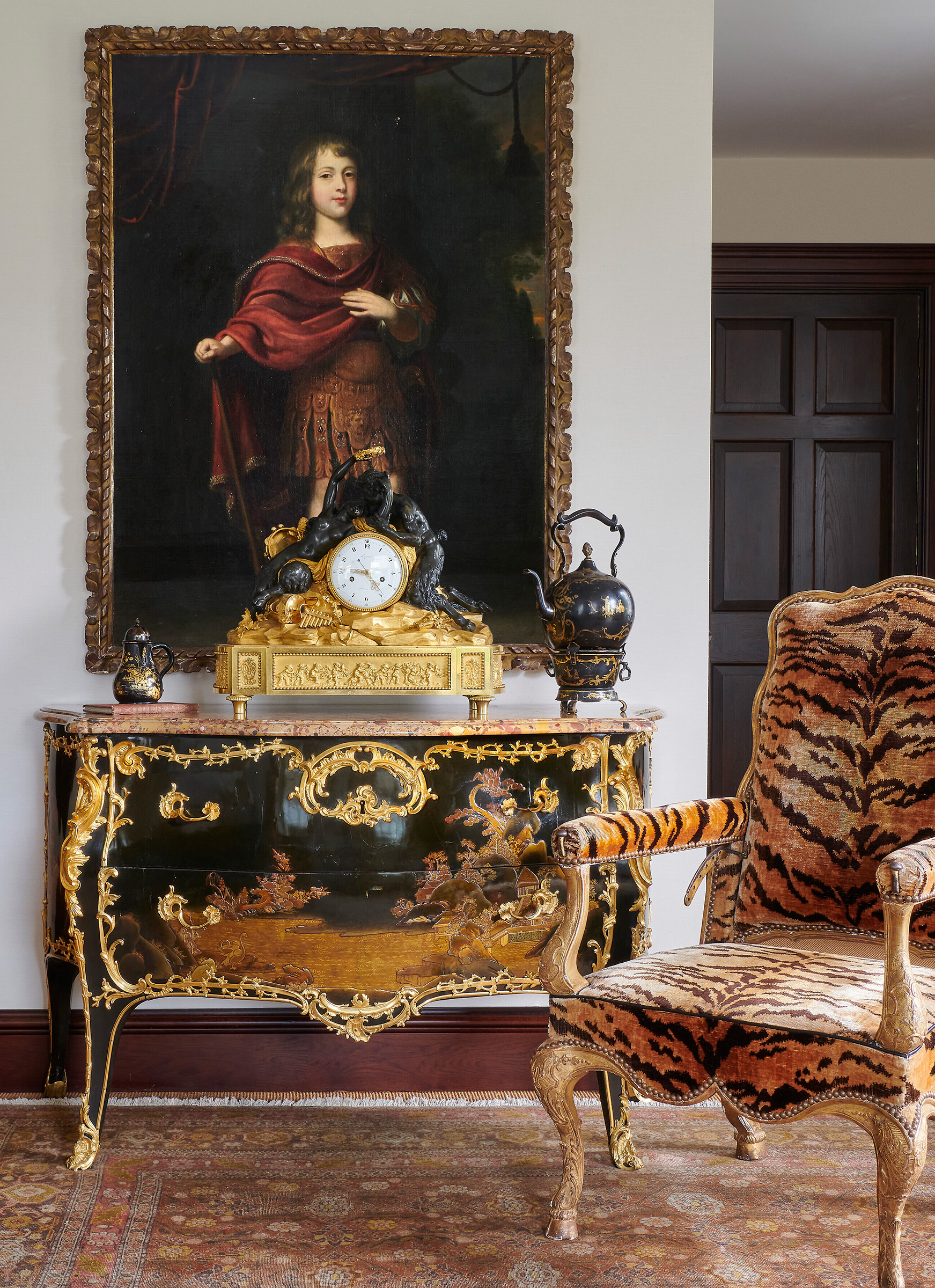 The French Bedroom, with Portrait of a young boy, full-length, in classical costume, a landscape beyond, Anglo-Dutch school, 17th century. A Louis XVI ormolu and patinated bronze striking mantel clock, Lepaute, Paris, late 18th century (sold for £27,720) sits on a Louis XV ormolu-mounted Japanese lacquer bombe commode, attributed to Jacques Dubois, mid-18th century (sold for £75,600). On the right is a Régence giltwood reclining fauteuil, circa 1715. Sold on 9 February 2023 at Christie’s in London