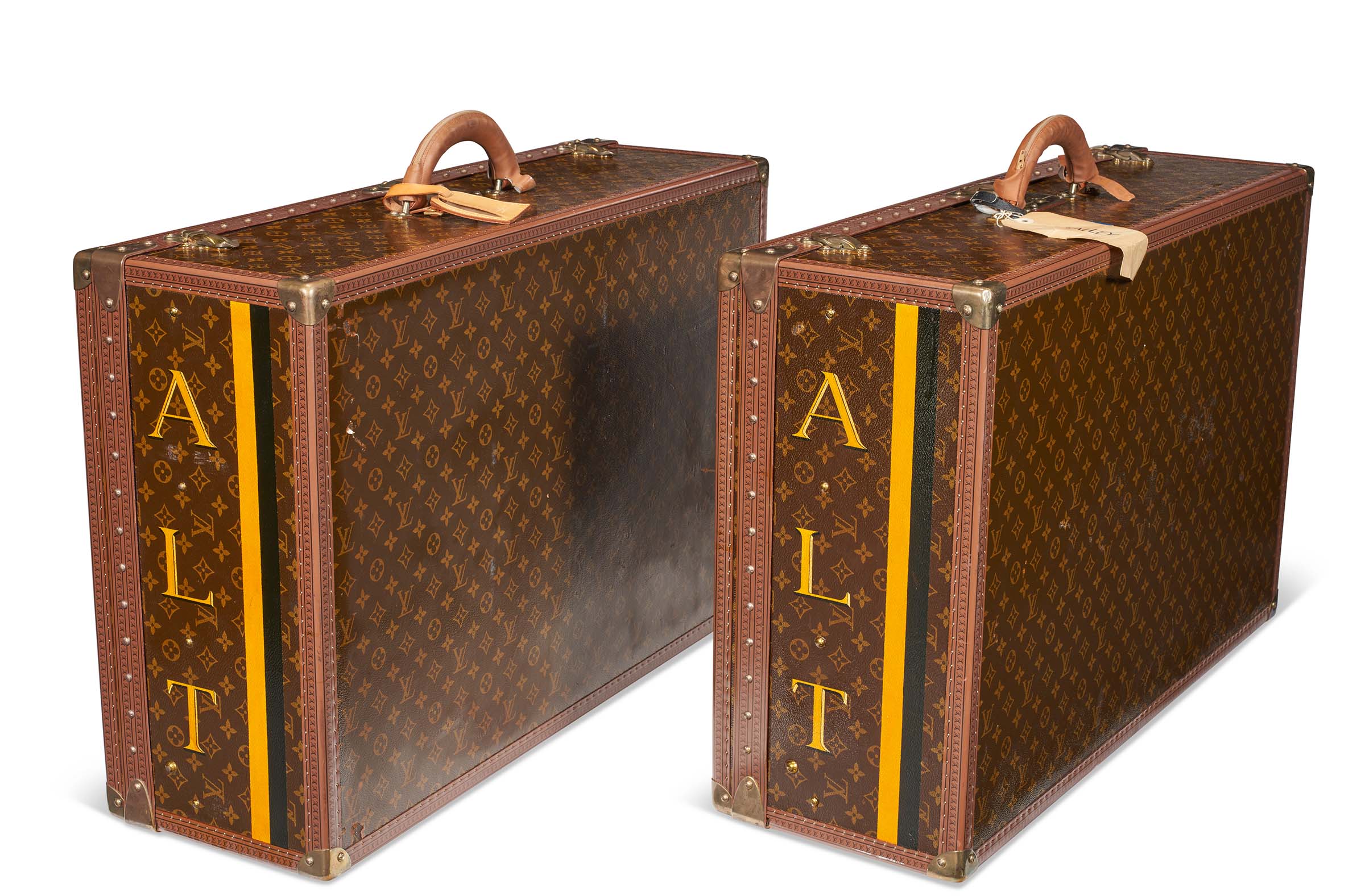 Left: A pair of personalized brown monogram lacquered canvas hardsided suitcases, Louis Vuitton, circa 1990. 80 w x 52 h x 25 d cm. Sold for $35,280 in The Collection of Andr&eacute; Leon Talley: Online on 16 February 2023 at Christie&rsquo;s online