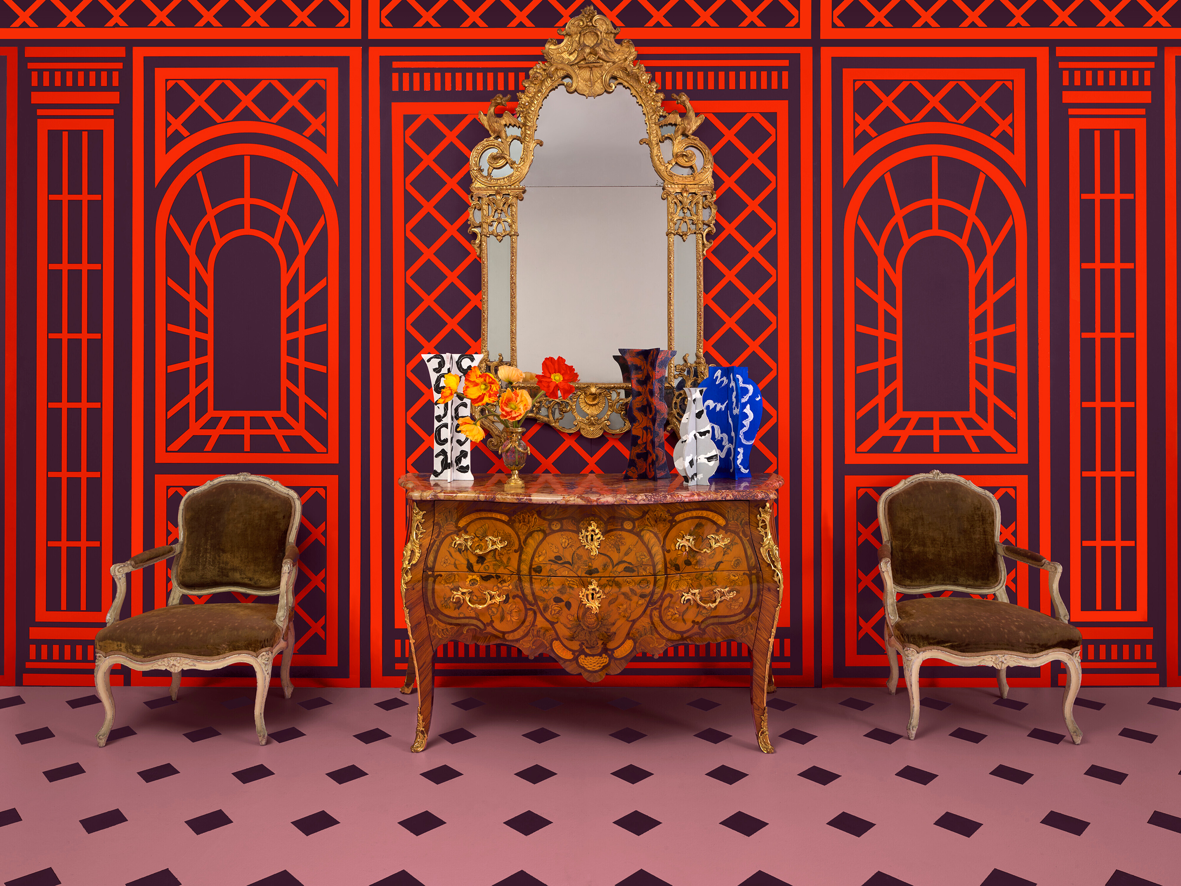 The Paris Edit: a Régence giltwood mirror, early 18th century (€5,000-8,000) hangs above one of a pair of Louis XV commodes, circa 1760 (€100,000-200,000). Flanking the composition are two from a suite of four Louis XV cream-painted armchairs, mid-18th century (€2,500-4,000). All offered in The Collector: Le Goût Français, 4-20 April 2023 at Christie’s Online