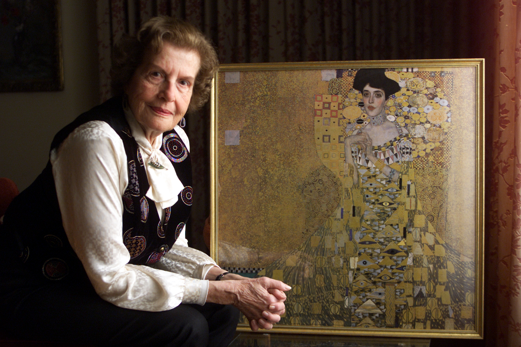 Maria Altmann with a reproduction Gustav Klimt's Portrait of Adele Bloch-Bauer I. Photograph by Lawrence K. Ho/Los Angeles Times via Getty Images