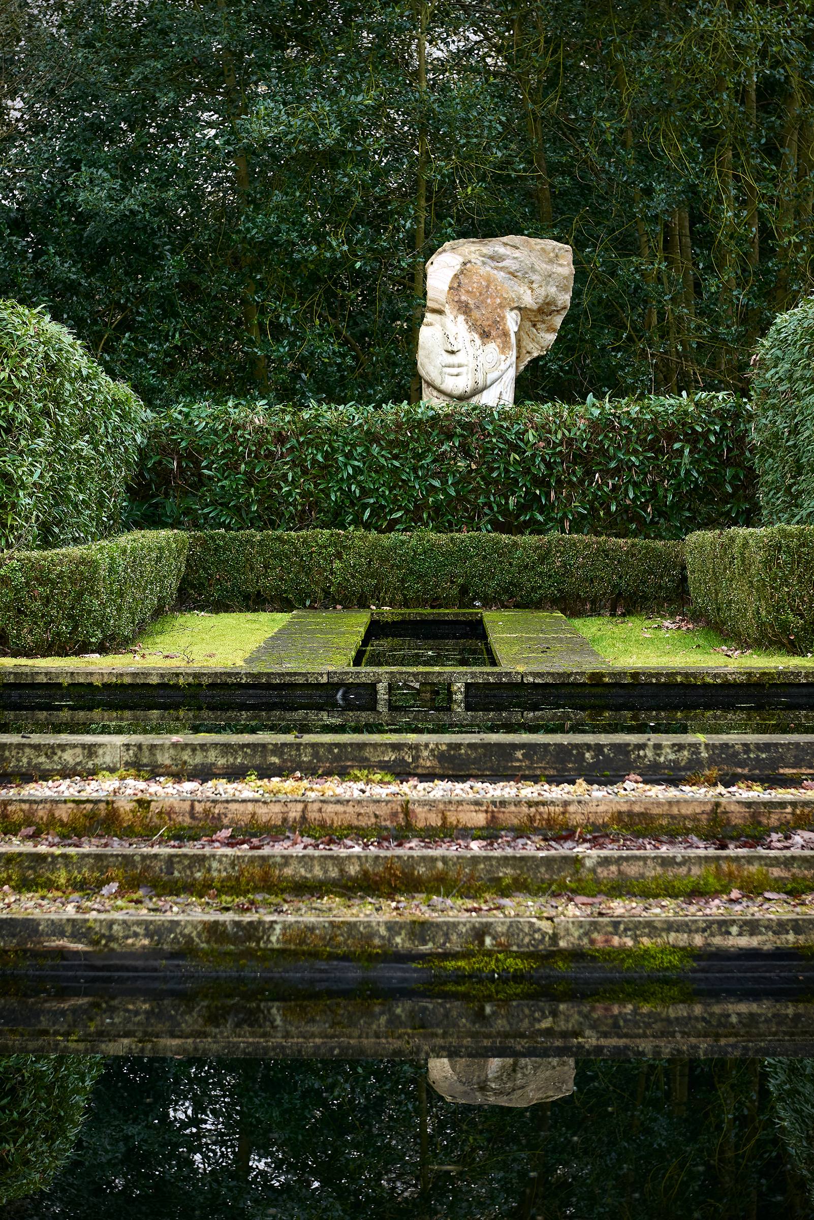 Emily Young (b. 1951), Time Boy, 2011, shown in situ at at Copse Farm in Hampshire. 66⅞ in (170 cm) high. Sold for £478,800 on 8 June 2023 at Christie’s in London