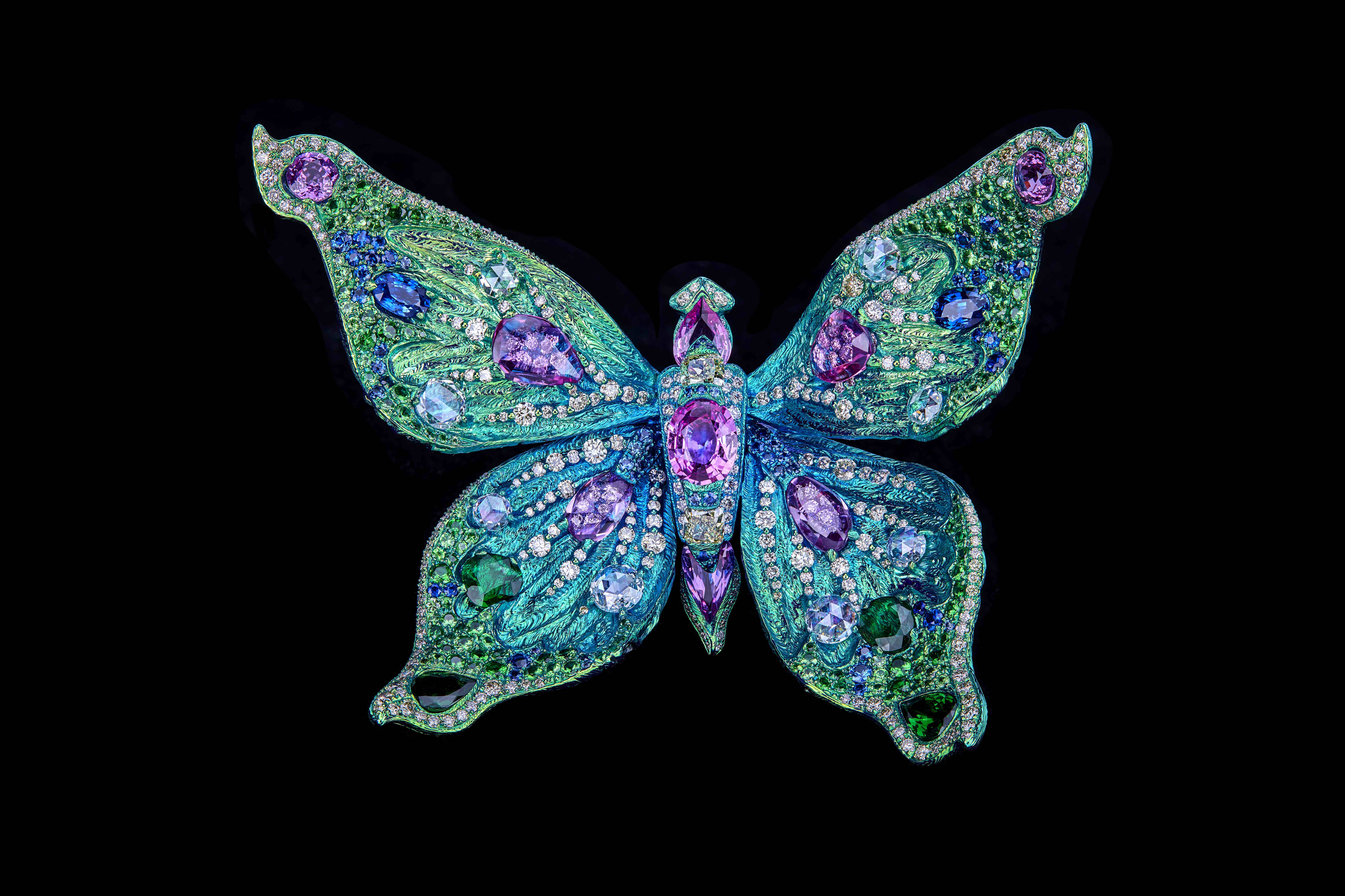 The Joy of Life brooch. Sapphires, tsavorite garnet, diamonds, pearl, titanium. On view in The Wheel of Time, 4-10 September 2023 at Christie’s in London