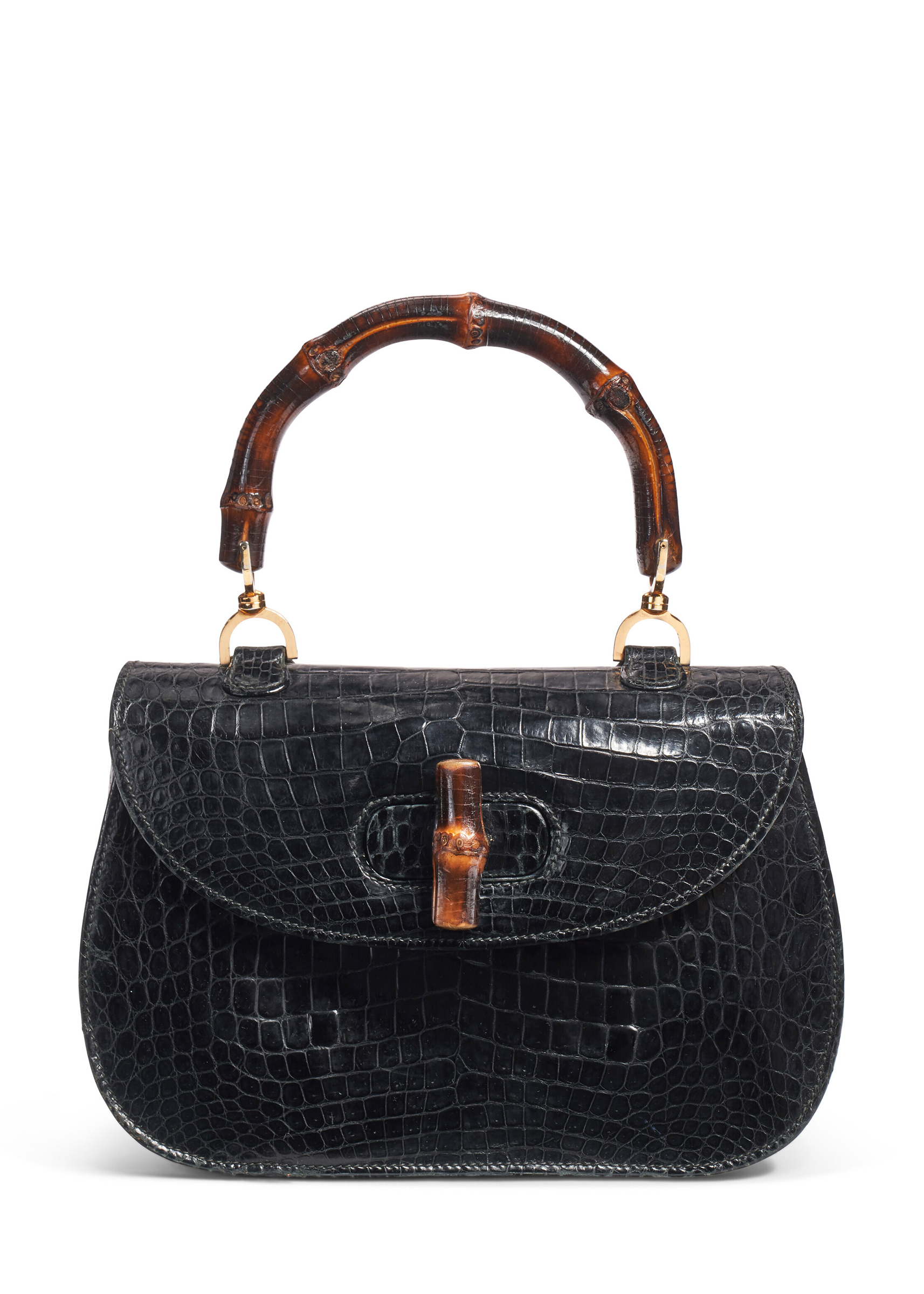 A black alligator Bamboo bag, Gucci, circa 1960. Sold for $4,032 on 12 December 2022 at Christie’s Online
