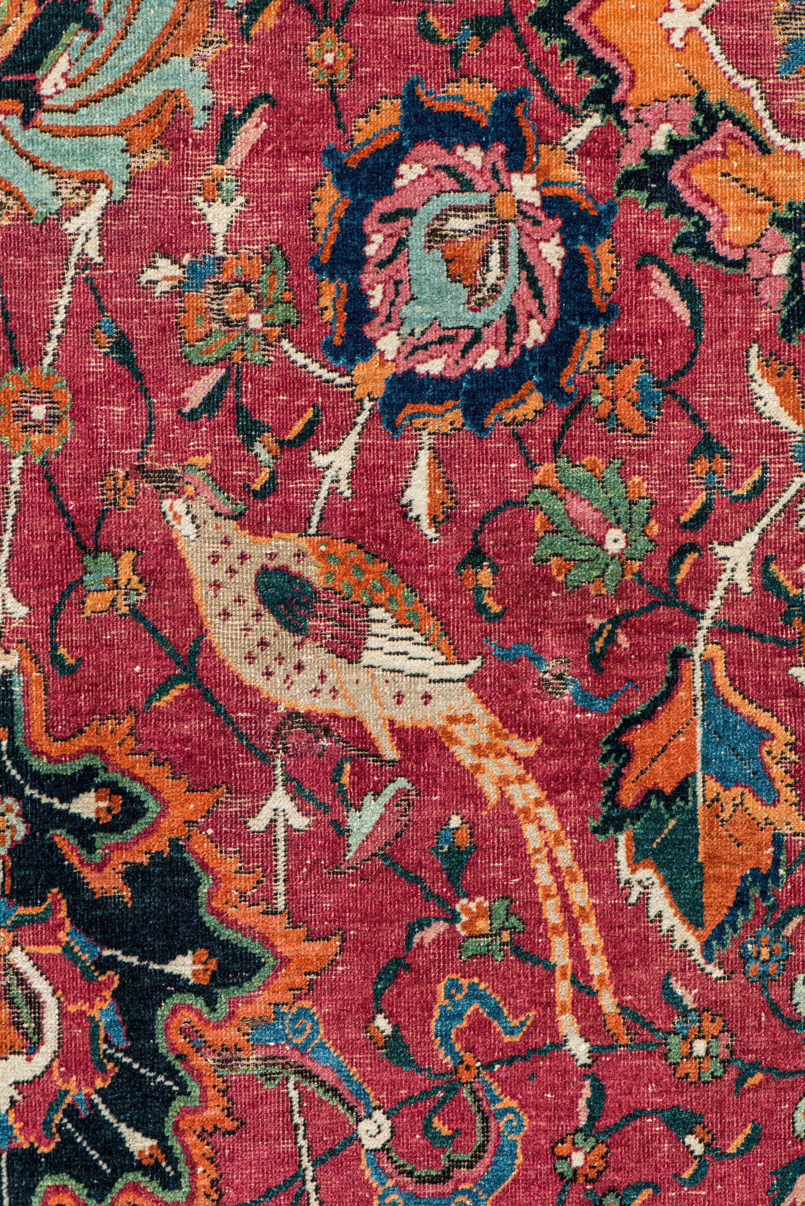Depicted among the swirls of intertwined vines, palmettes and cascading flowers are long-plumed birds thought to be pheasants