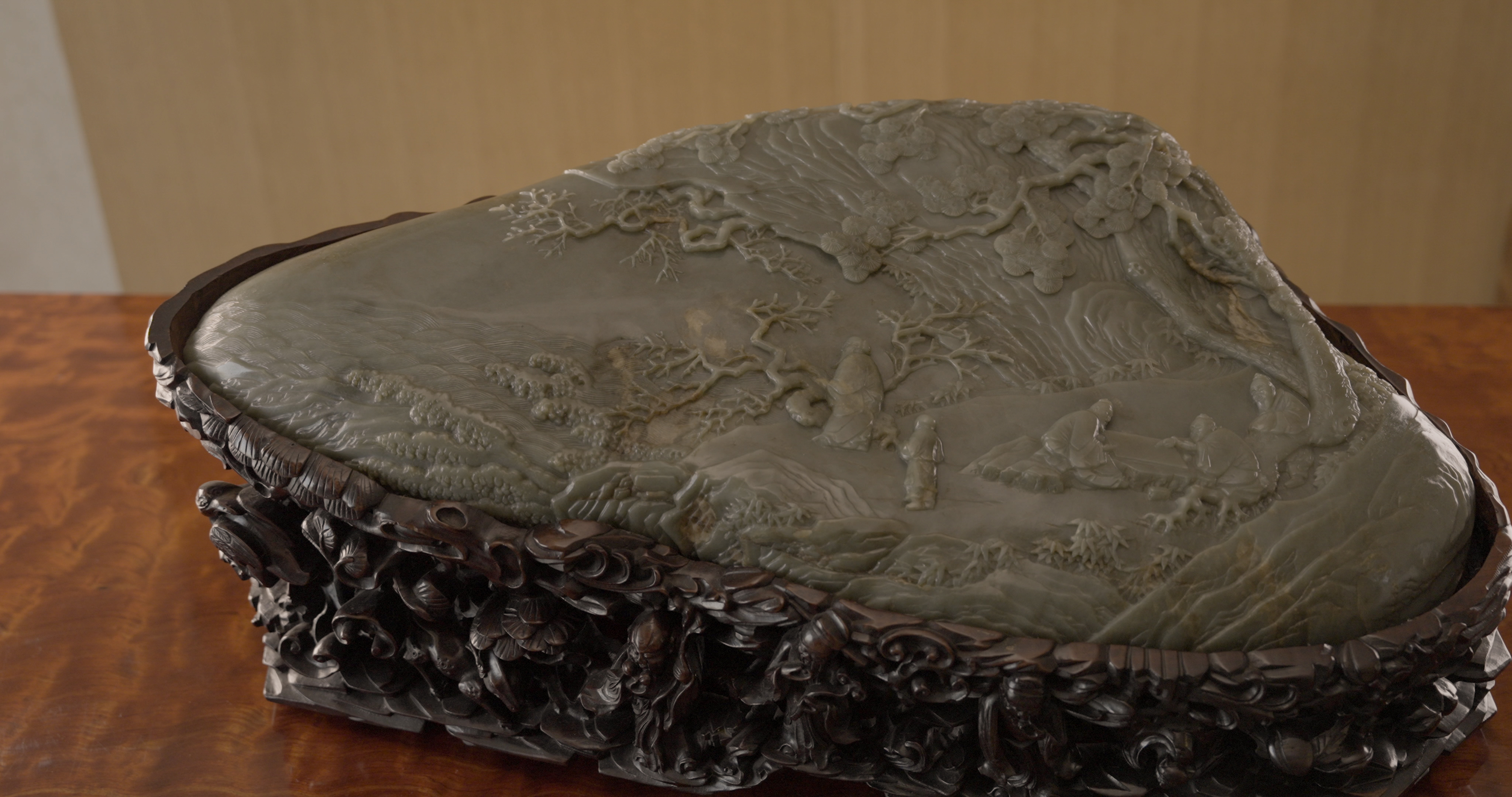 An Important Imperial Massive Inscribed Celadon Jade &lsquo;Four Sages&rsquo; Mountain Boulder