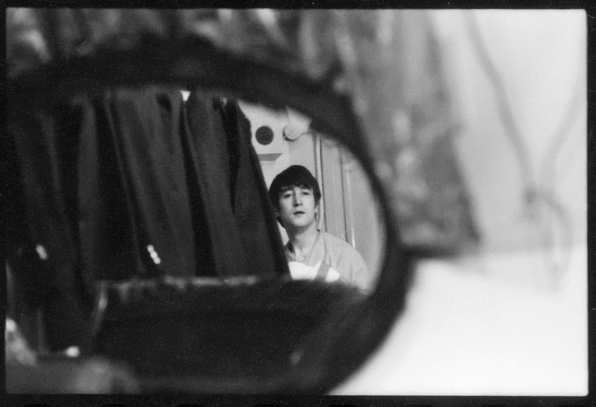 John Lennon, backstage in London, 1964. © 1963-1964 Paul McCartney under exclusive license to MPL Archive LLP