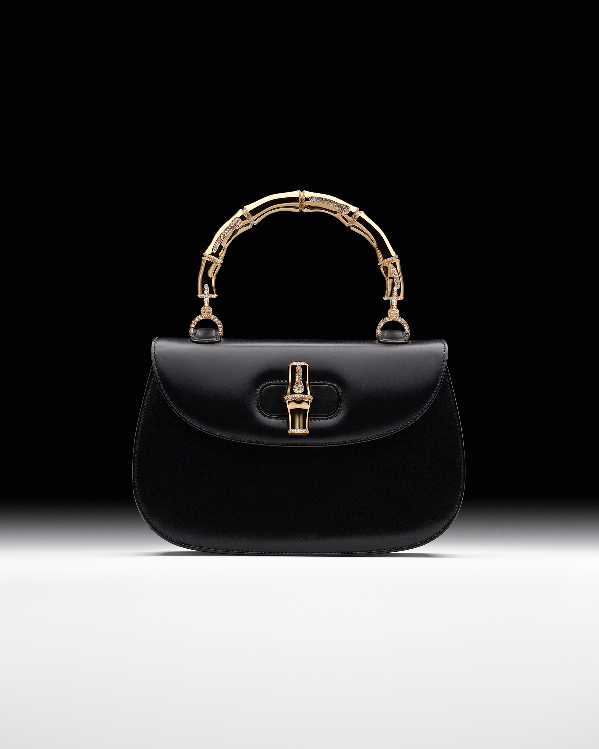 A unique black leather Gucci Bamboo bag with 18ct yellow gold handle and closure encrusted with 927 38-carat white diamonds, 1960 and 2023, offered in Handbags Online: The Paris Edit, 31 October to 14 November 2023 at Christie's