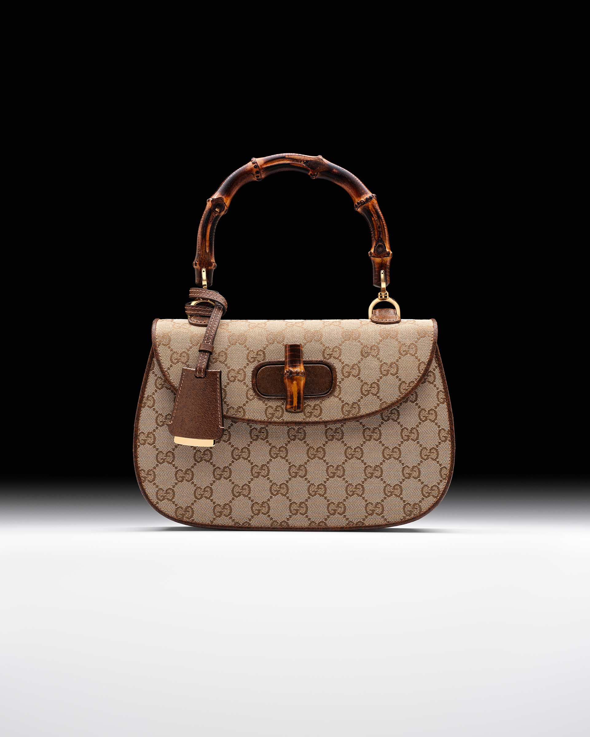 A rare beige and ebony original GG canvas Gucci Bamboo bag with bamboo handle and closure, 1960 and 2023, offered in Handbags Online: The Paris Edit, 31 October to 14 November 2023 at Christies