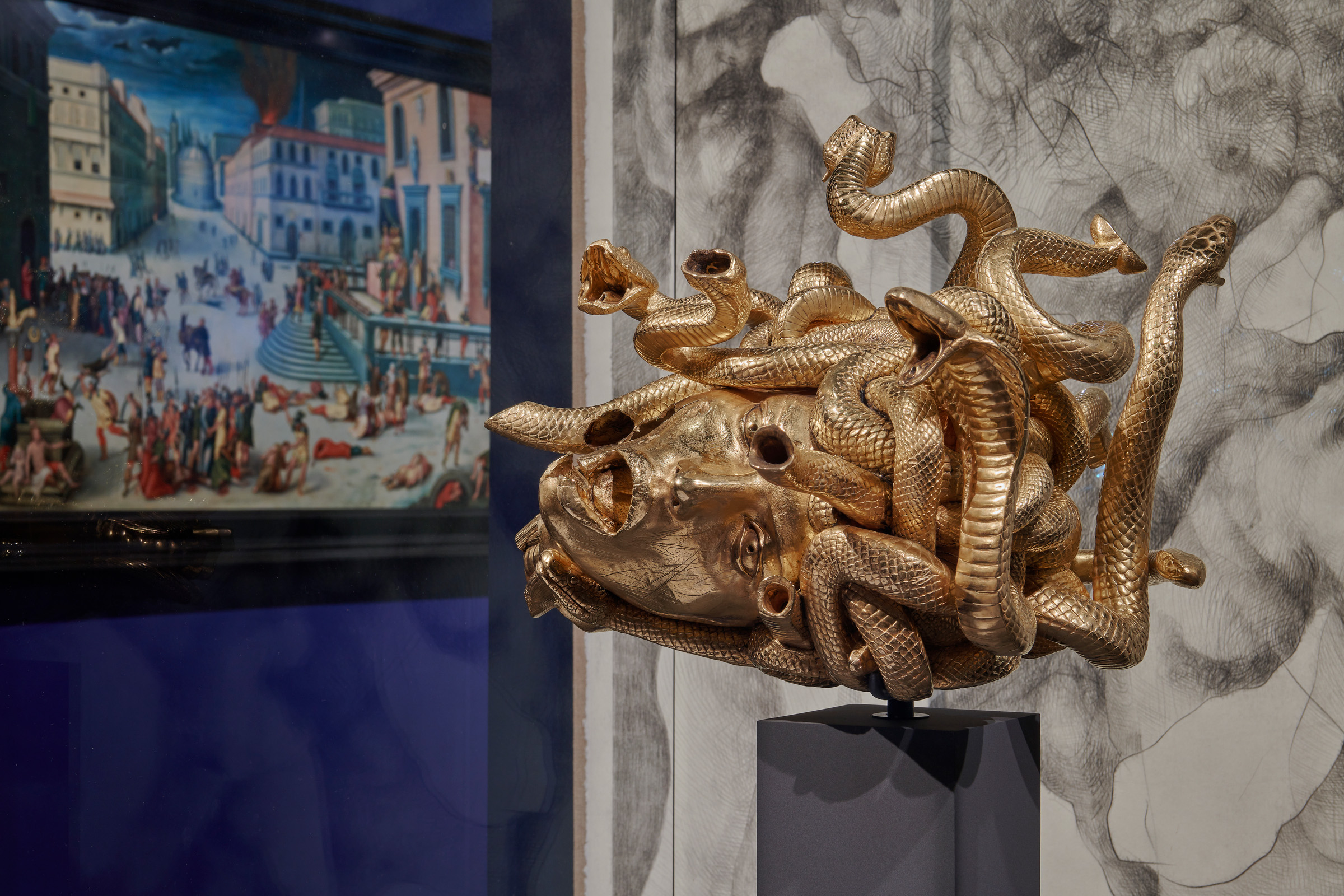 Damien Hirst, The Severed Head of Medusa, 2013. The painting is Massacre under the Triumvirate, Circle of Antoine Caron