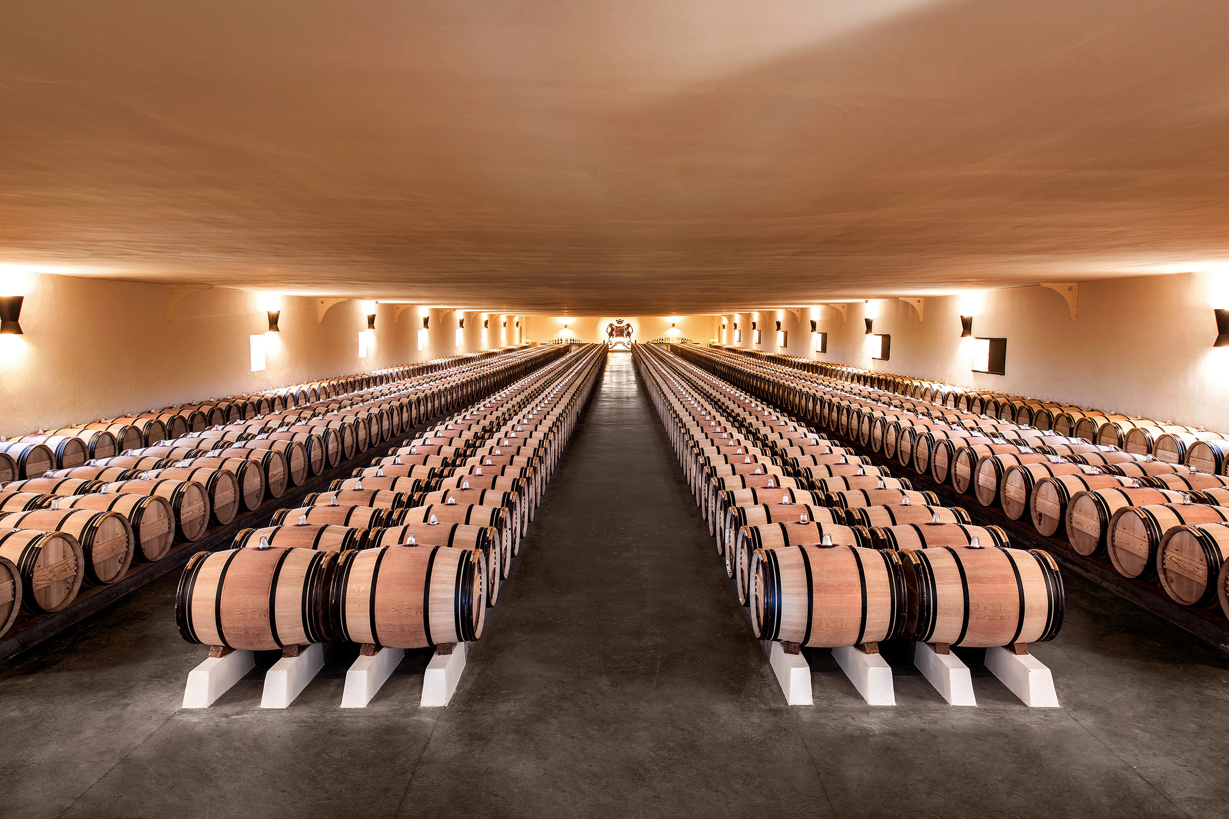 Baron Philippe de Rothschild's radical decision to bottle the entire vintage on site led to the creation of Chateau Mouton Rothschild's Great Barrel Hall in 1926. The building is 100 metres long and can hold up to 1,000 casks