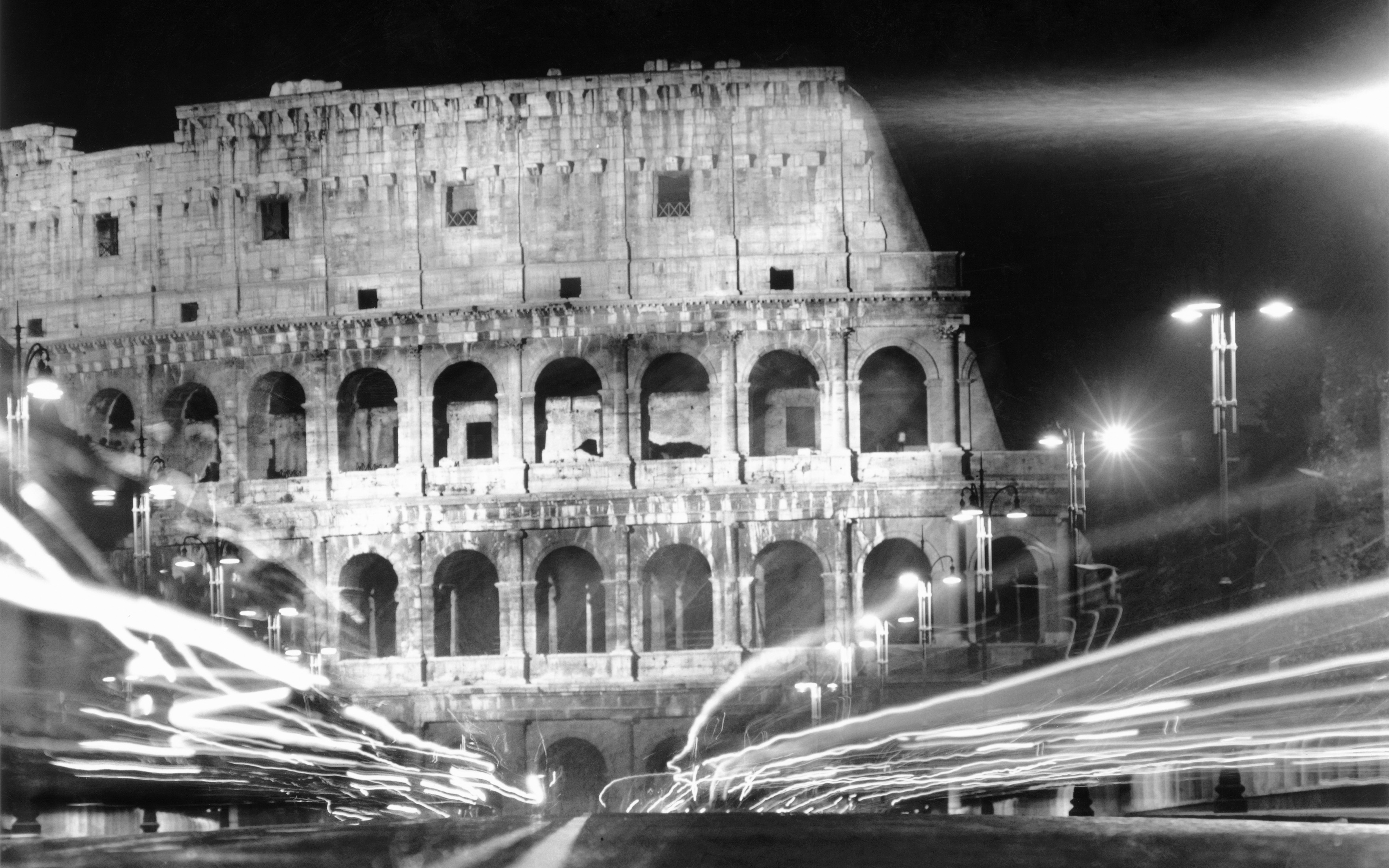 Rome, July 1960. Trails of light made by passing cars give an impressionistic look to the Colosseum