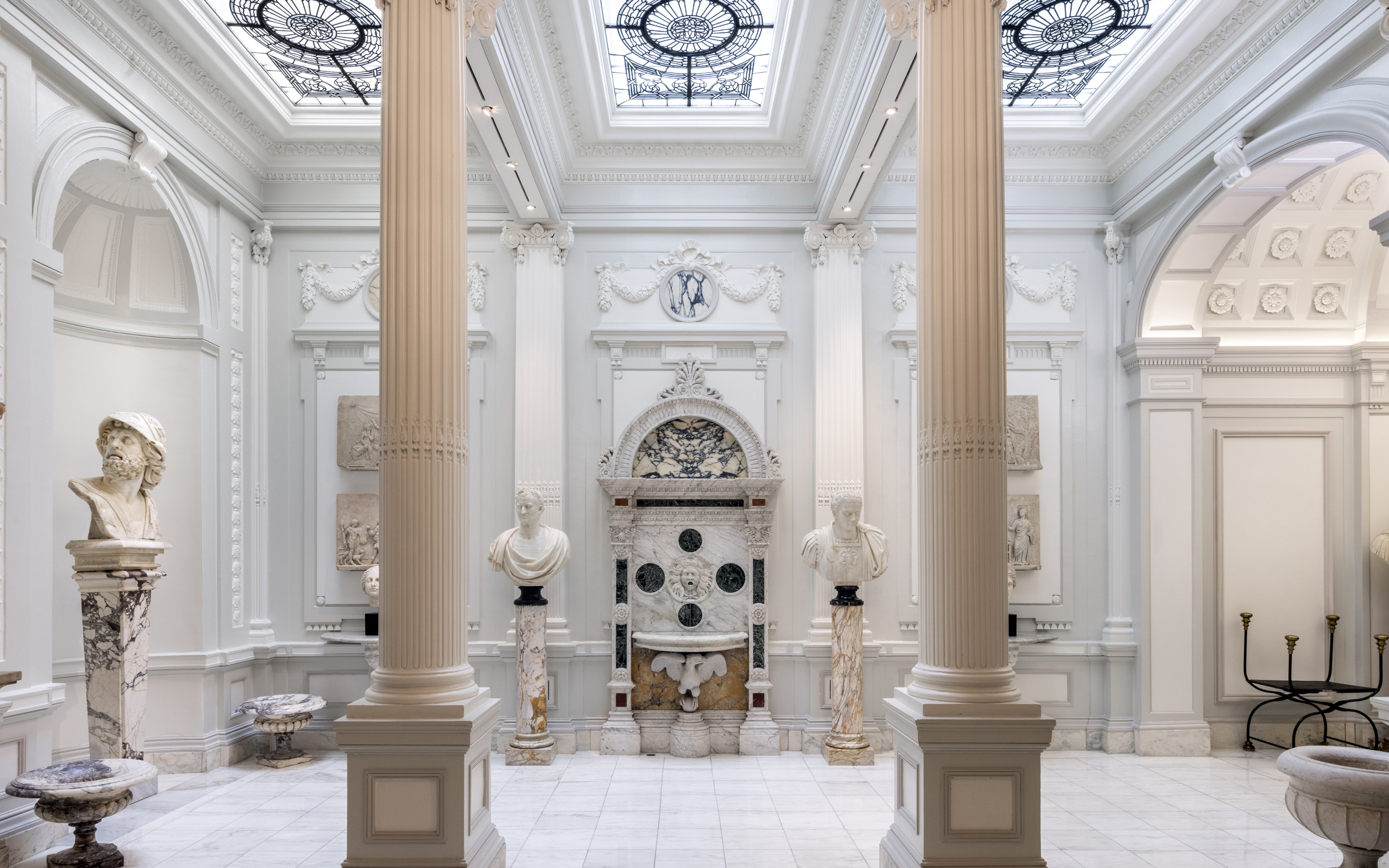 The James F. D. Lanier Residence gallery lined with carved niches, classical statuary and monumental carved-stone basins