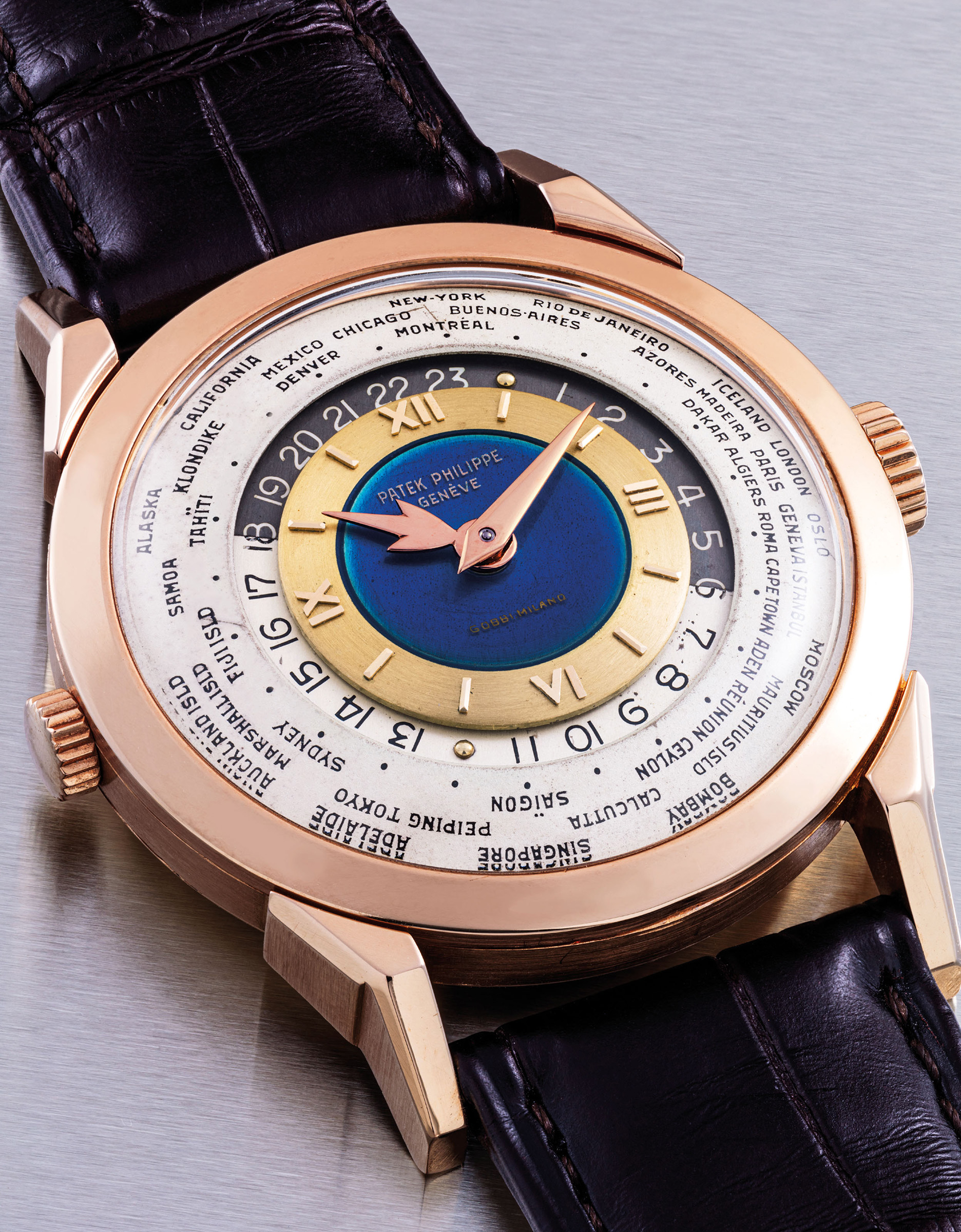 Patek Philippe. An 18k pink gold two-crown world-time wristwatch with 24-hour indication, 'Heures Universelles', ref. 2523, 1953, retailed by Gobbi, sold for HK$70,175,000 on 27 November 2019 at Christie's in Hong Kong