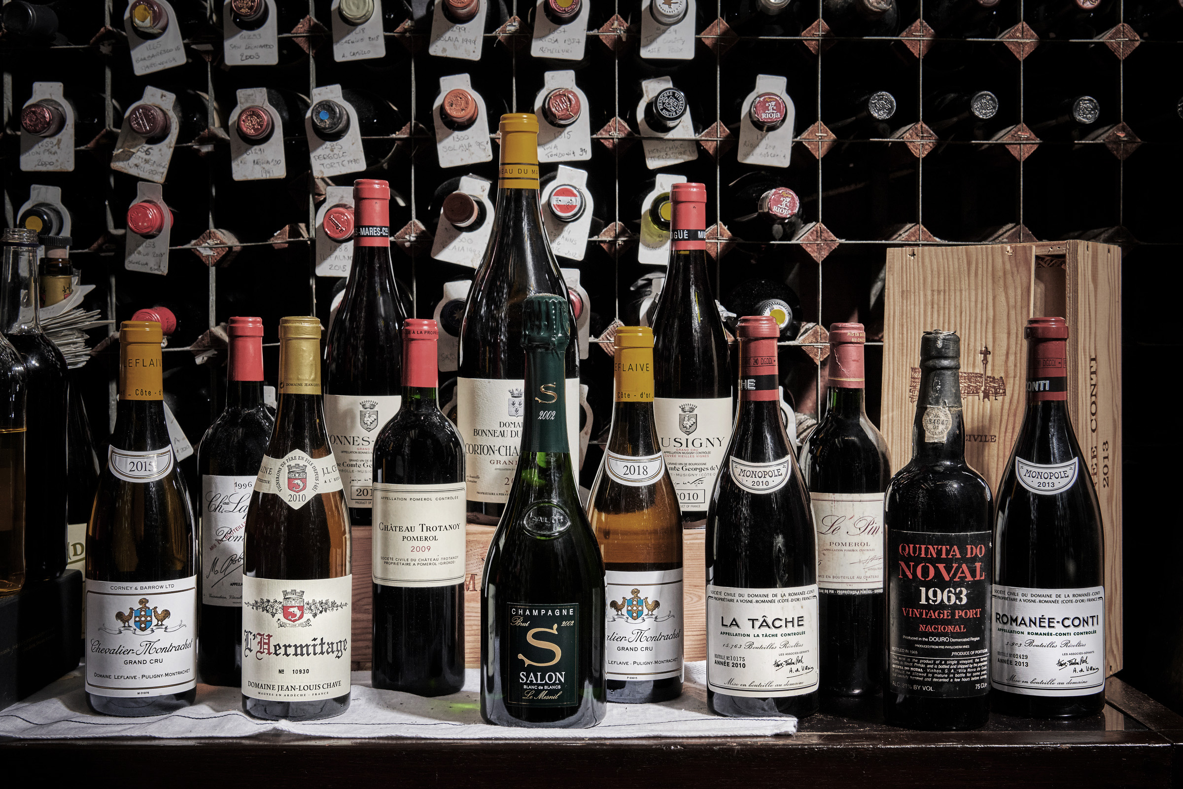 Bottles from the Tardis-like 'daily cellar', left to right: Chevalier Montrachet Domaine Leflaive 2015; Chateau Lafleur 1996; Hermitage Blanc Domaine Jean Louis Chave 2010; Bonnes-Mares Domaine de Vogue 2010; Chateau Trotanoy 2009; Corton Charlemagne Bonneau du Martray 2017; Salon Le Mesnil 2002; Chevalier Montrachet Domaine Leflaive 2018; Musigny Vieilles Vignes Domaine de Vogue 2010; La Tache Domaine de la Romanee-Conti 2010; Le Pin 1995; Quinta do Noval Nacional 1963; and Romanee-Conti Grand Cru 2013