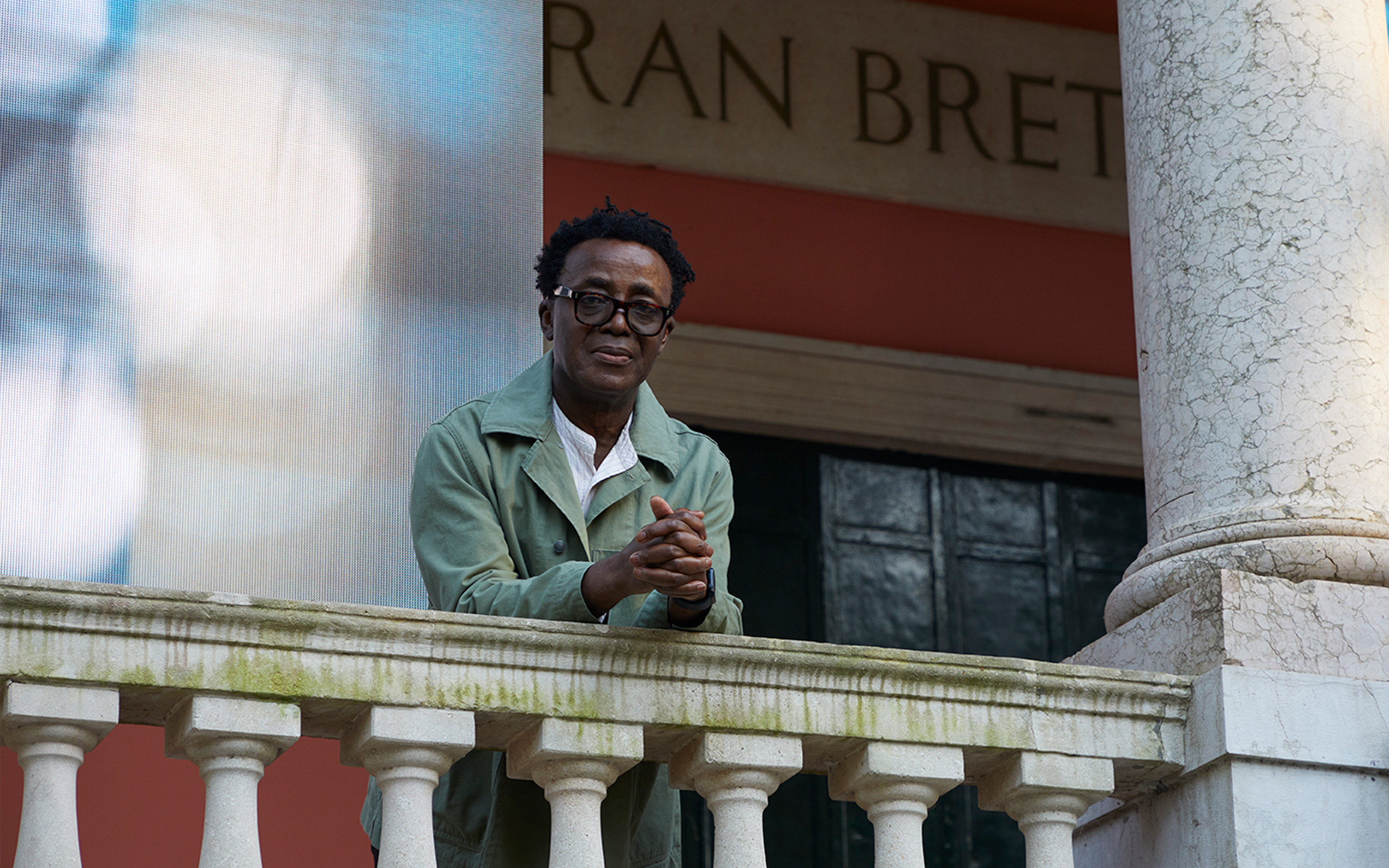Artist John Akomfrah, who describes migration as a 'profoundly utopian project', photographed by Christian Cassiel