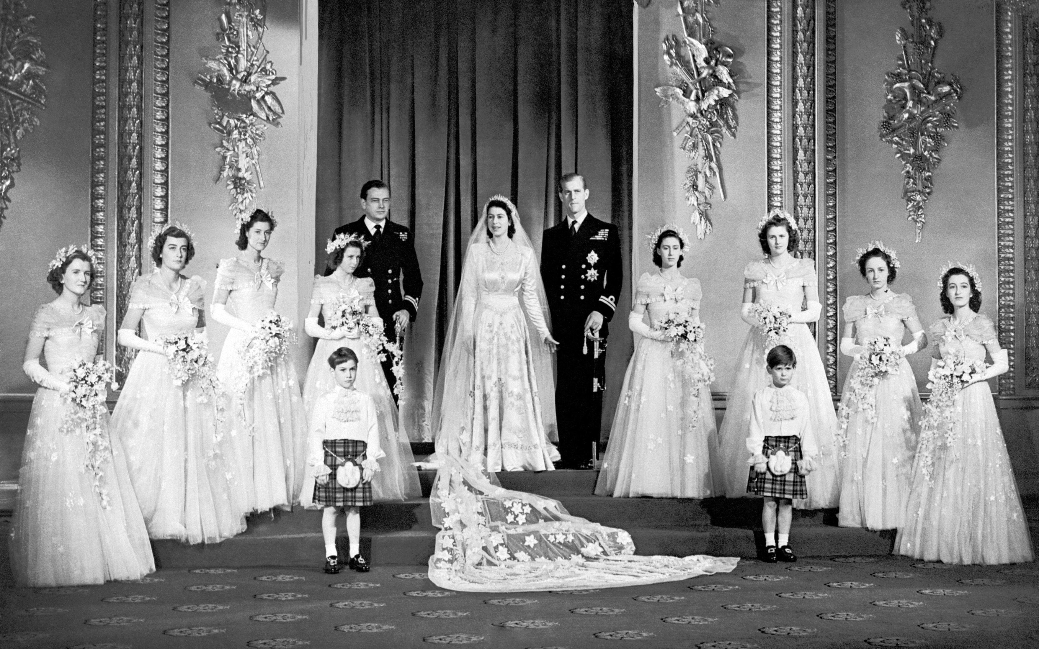 The Duke of Edinburgh and Princess Elizabeth (later Queen Elizabeth II) with their bridesmaids in the Throne Room at Buckingham Palace immediately after their wedding ceremony, 20 November 1947. The bridesmaids, from left, are The Hon. Margaret Elphinstone, The Hon. Pamela Mountbatten, Lady Mary Cambridge, Princess Alexandra of Kent, Princess Margaret, Lady Caroline Montagu-Douglas-Scott, Lady Elizabeth Lambart and The Hon. Diana Bowes-Lyon