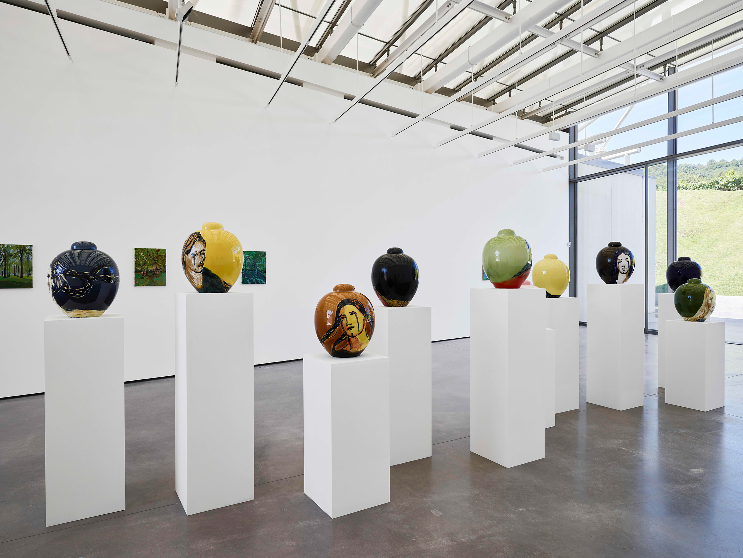 An installation view of Claire Tabouret's exhibition L'eloquence des larmes in the Renzo Piano Pavilion at Chateau La Coste