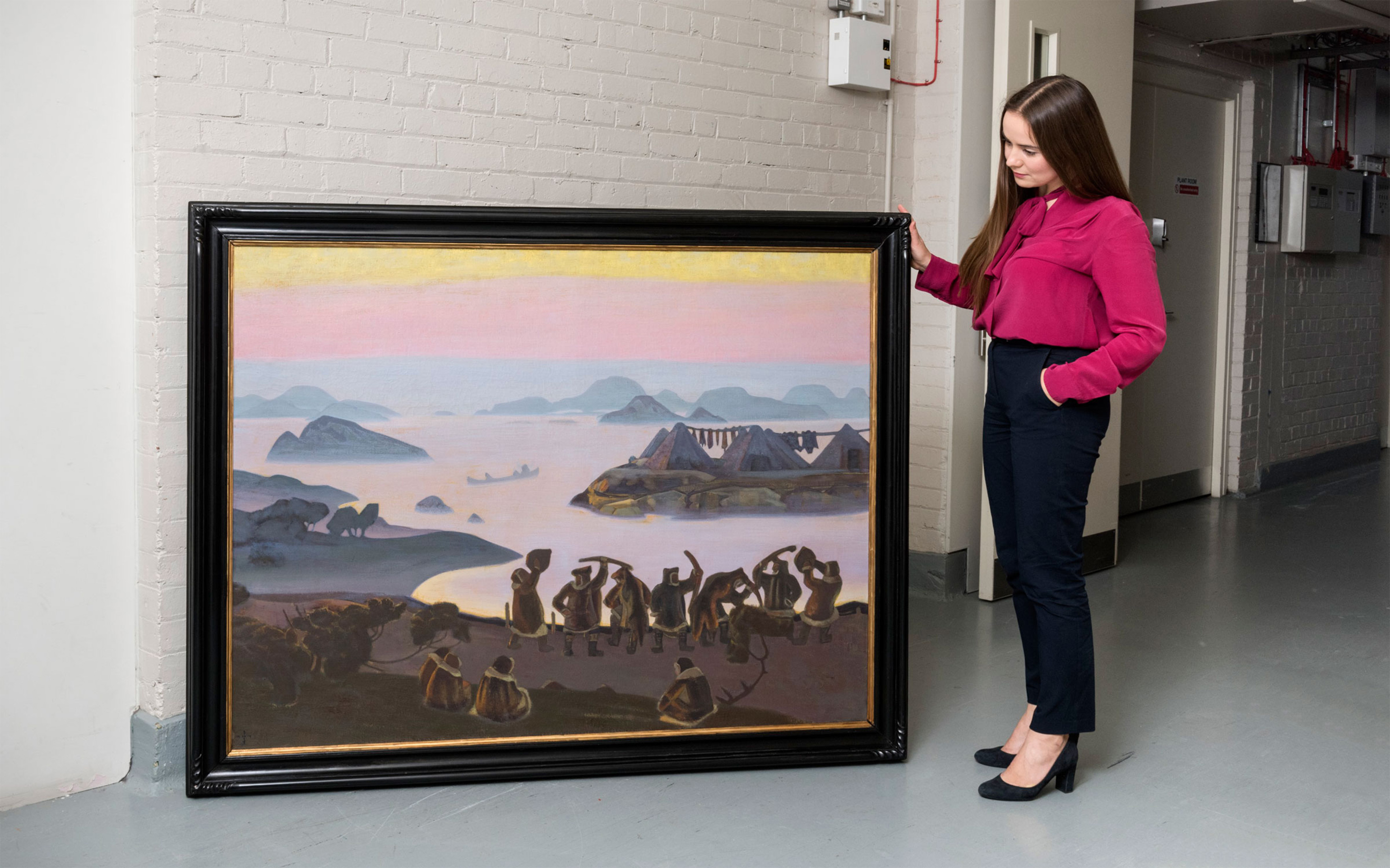 Christie's specialist Aleksandra Babenko with Nicholas Roerich's 1919 work, The Call of the Sun