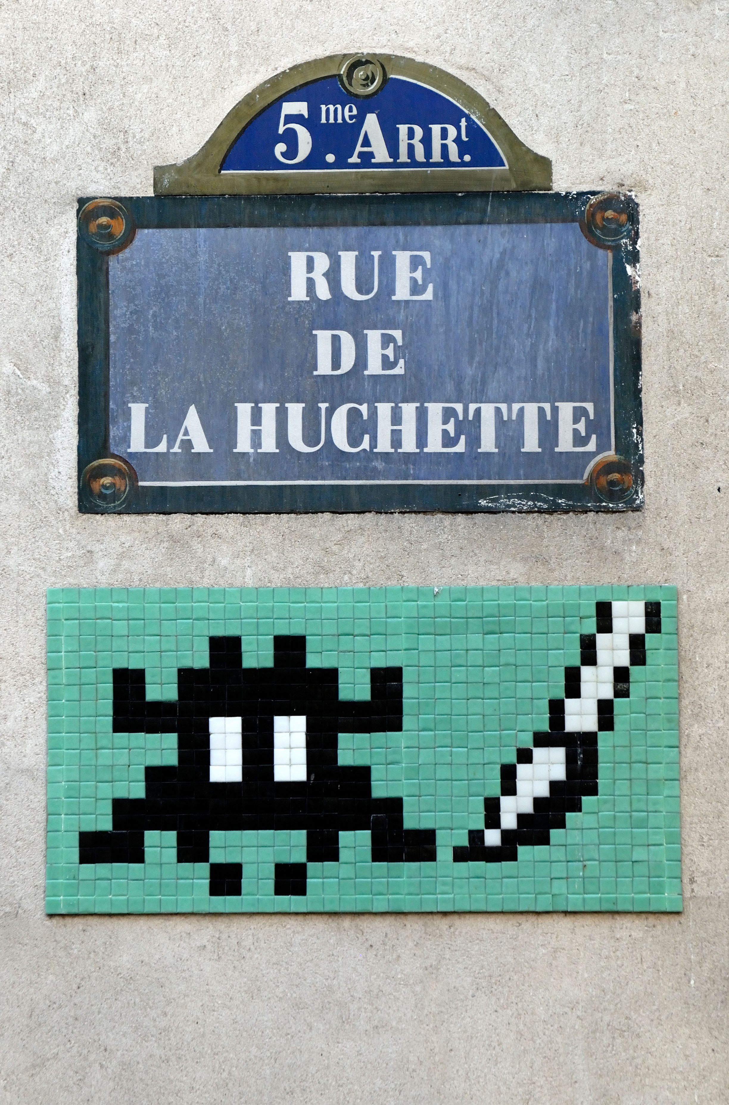 An Invader mosaic on the the Left Bank in Paris. As of September 2024, more than 4,000 of his mosaics have 'invaded' the walls of some 80 cities