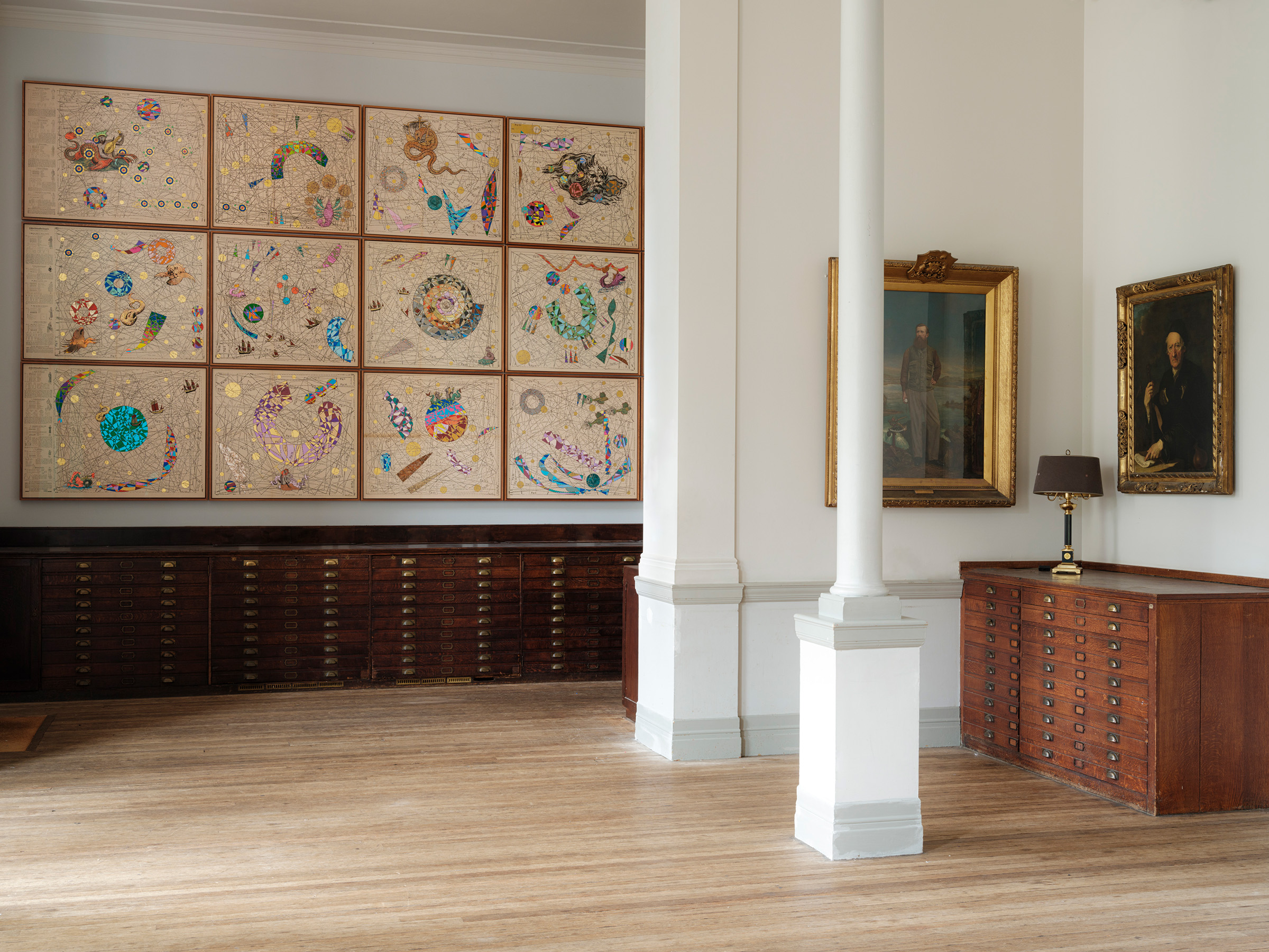 Part of Hormazd Narielwalla's Expanding Universe in the Map Room at the Royal Geographical Society in London, alongside portraits of explorers
