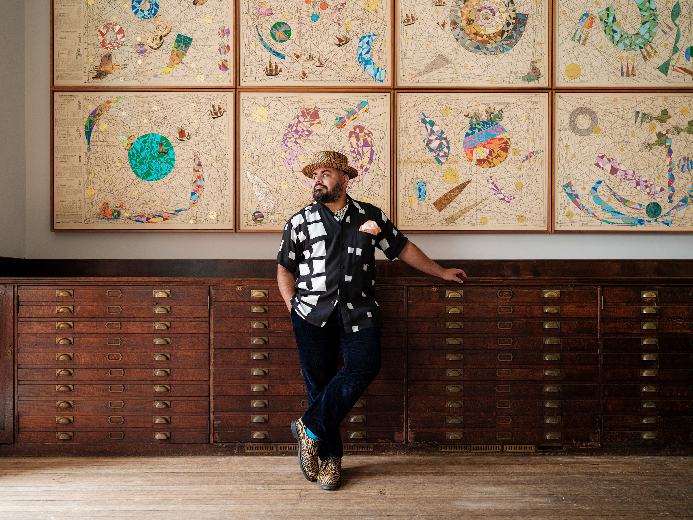 Hormazd Narielwalla with Expanding Universe at the Royal Geographical Society. The work is painted in acrylic and gold leaf on tailoring patterns from the 1920s