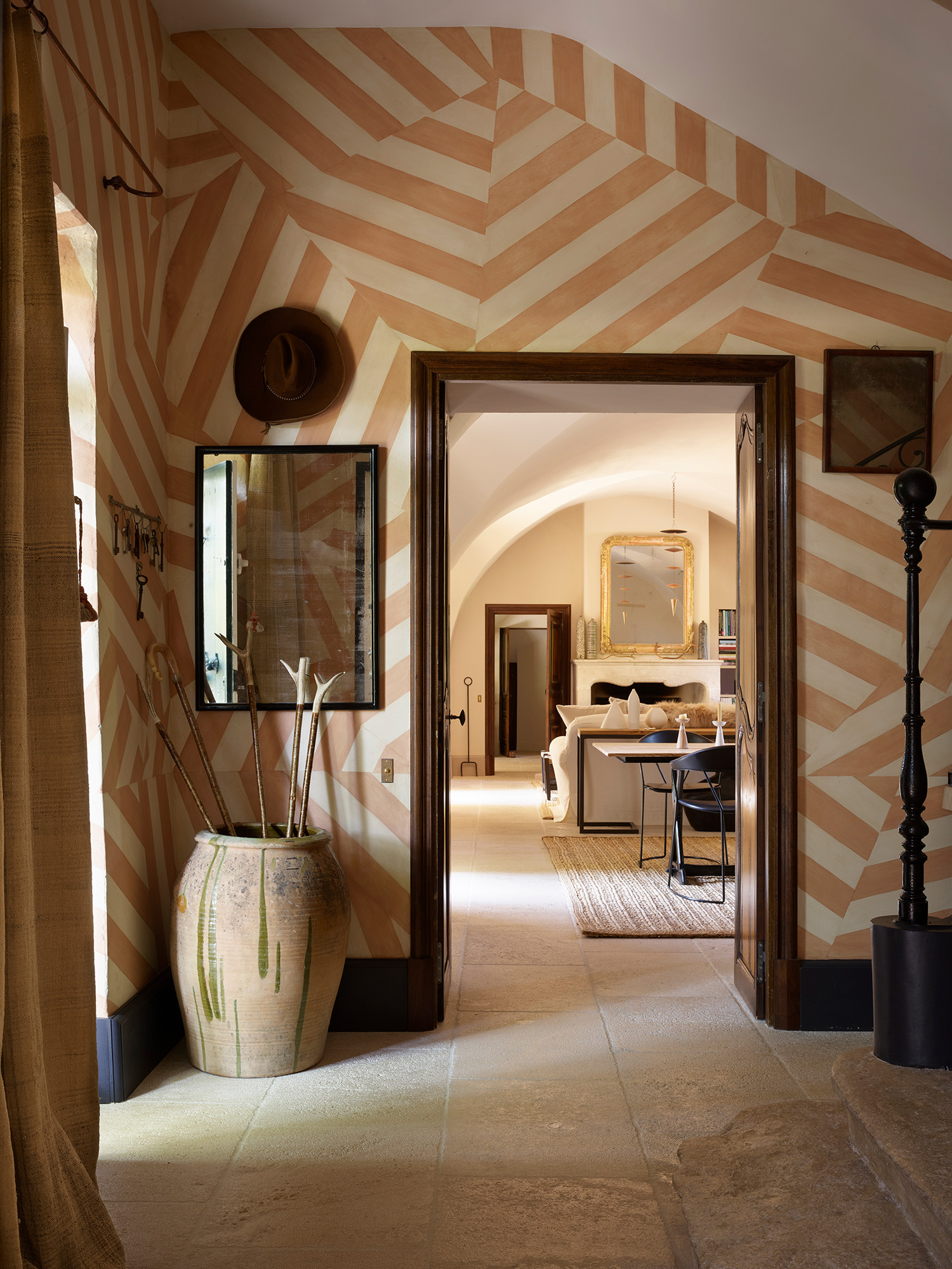 In the hallway of this French house is a mural inspired by Bedouin tents. It was painted by Lin Connor to the design of decorator Lucy Hammond Giles, a director of Sibyl Colefax and John Fowler