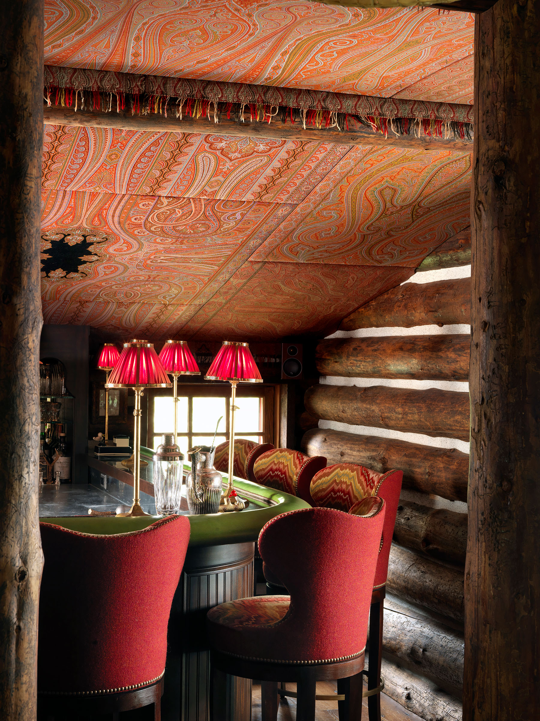 In the bar of the Wisconsin camp, Burns used antique paisley shawls to upholster a vaulted ceiling