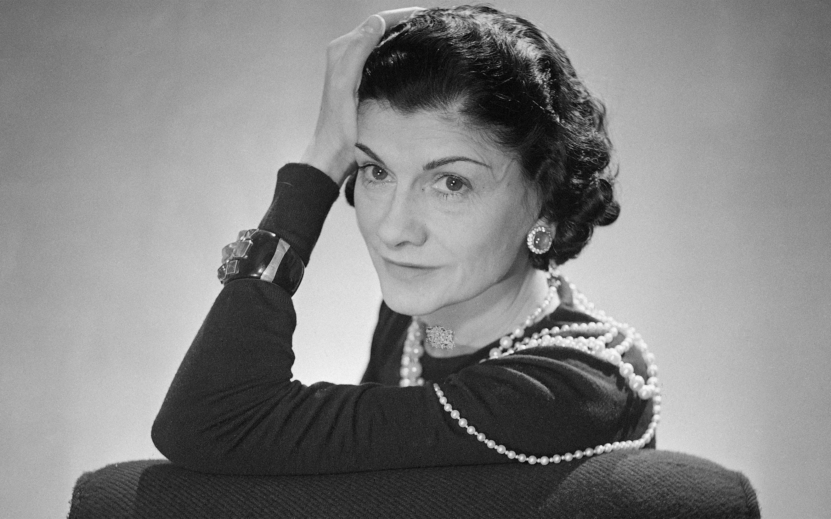 Coco Chanel wearing her trademark pearls in 1936, photographed by Boris Lipnitzki