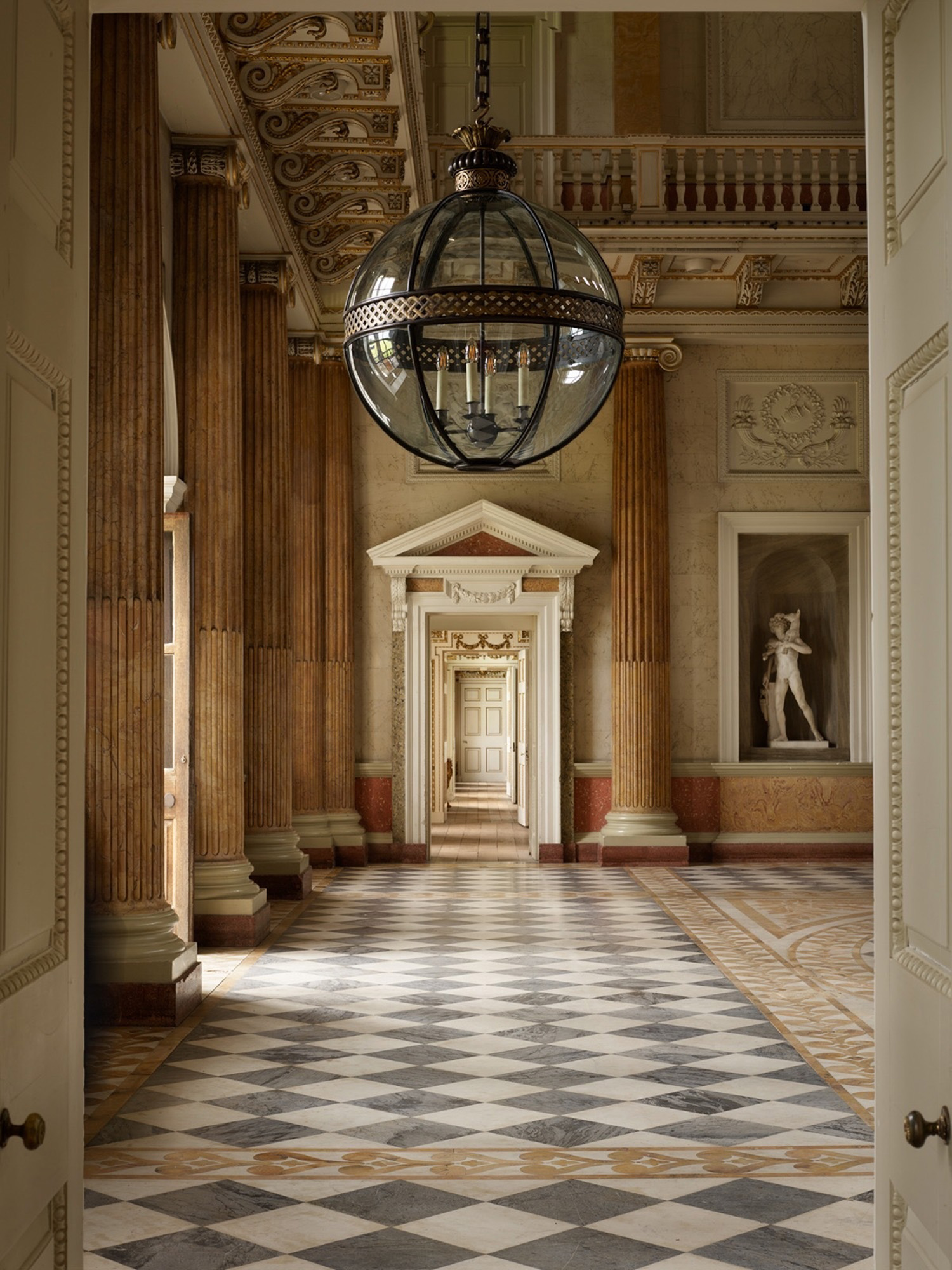 A Grand Lattice Globe in gilt brass and bronze by Jamb, in the entrance hall of Wentworth Woodhouse, South Yorkshire