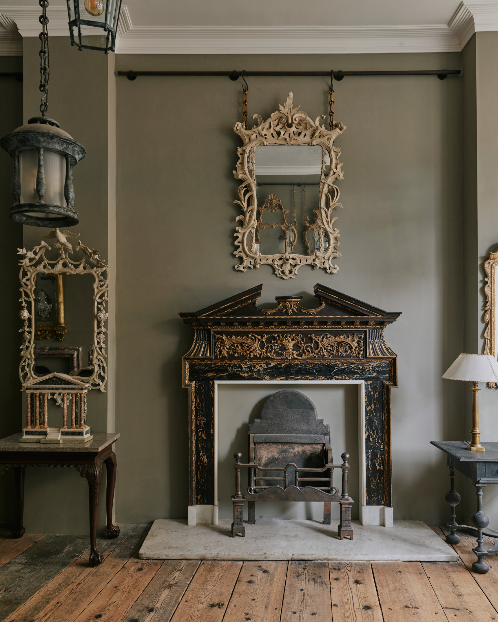 A unique 18th-century Palladian chimneypiece in parcel-gilt and Portoro Nero marble at Jamb's Pimlico Road showroom