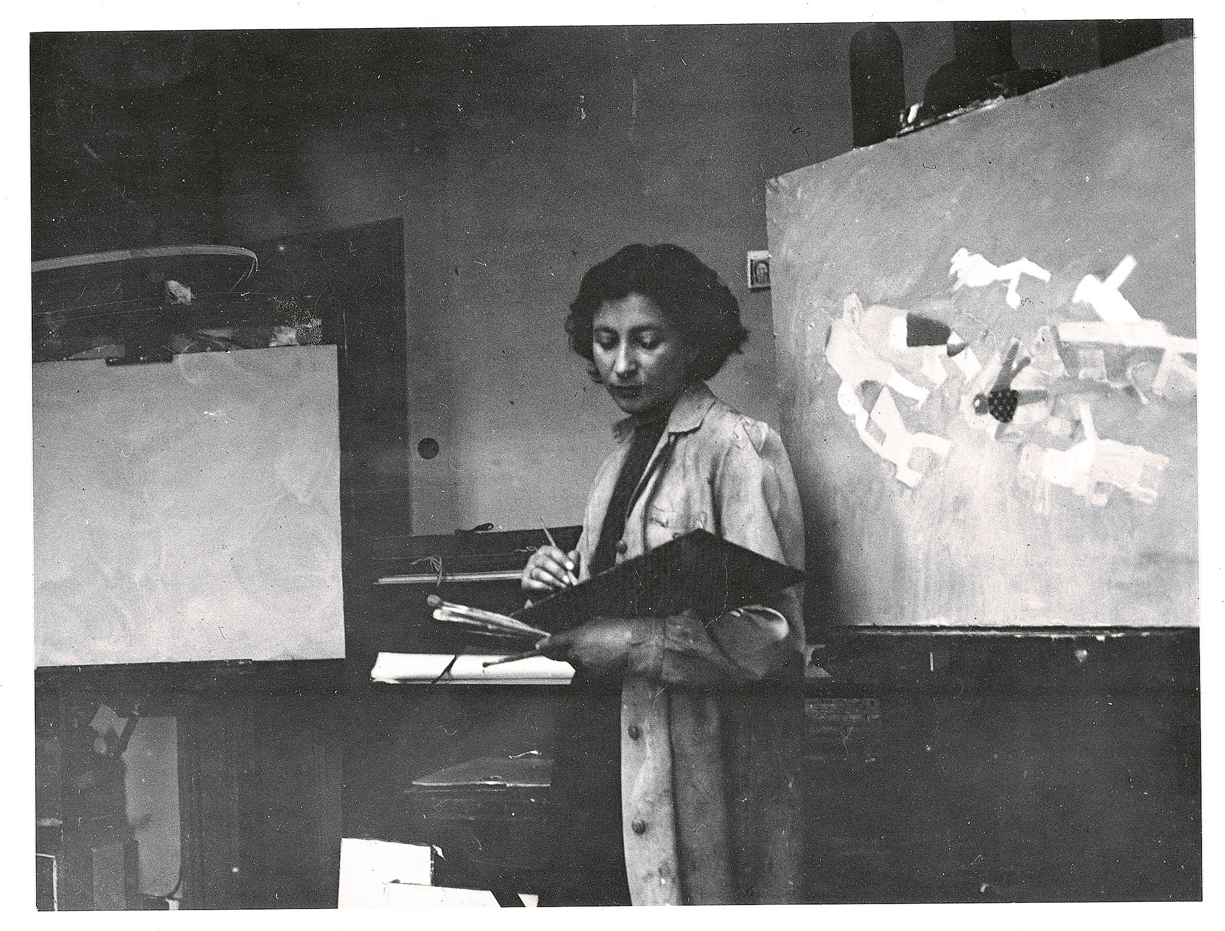 Franciszka Themerson in her London studio, 1947, working on Eleven Persons and One Donkey Moving Forwards, which is offered at Christie's in London on 19 March