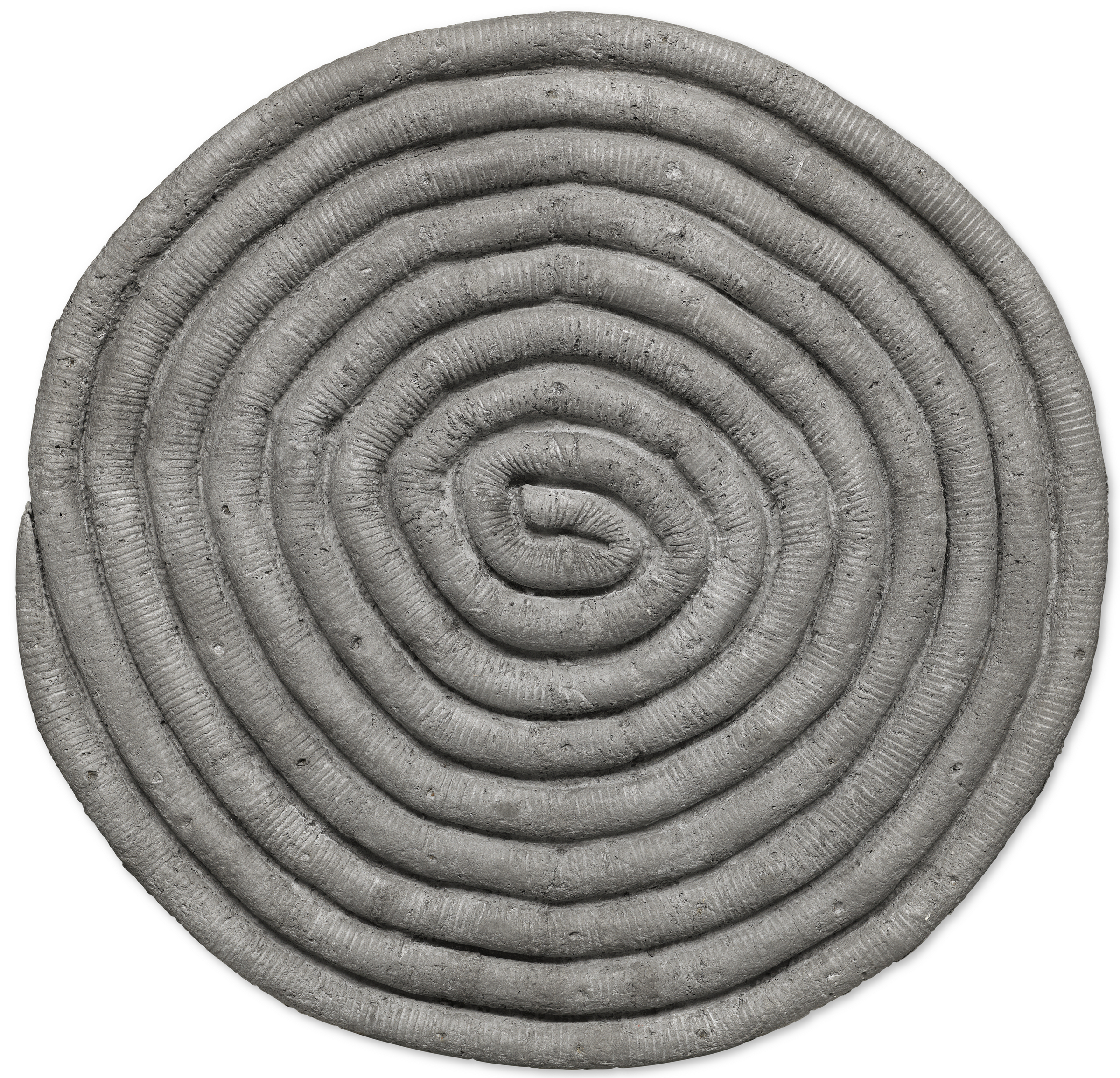 The image shows a textured, concentric spiral pattern with a rough, stone-like appearance.