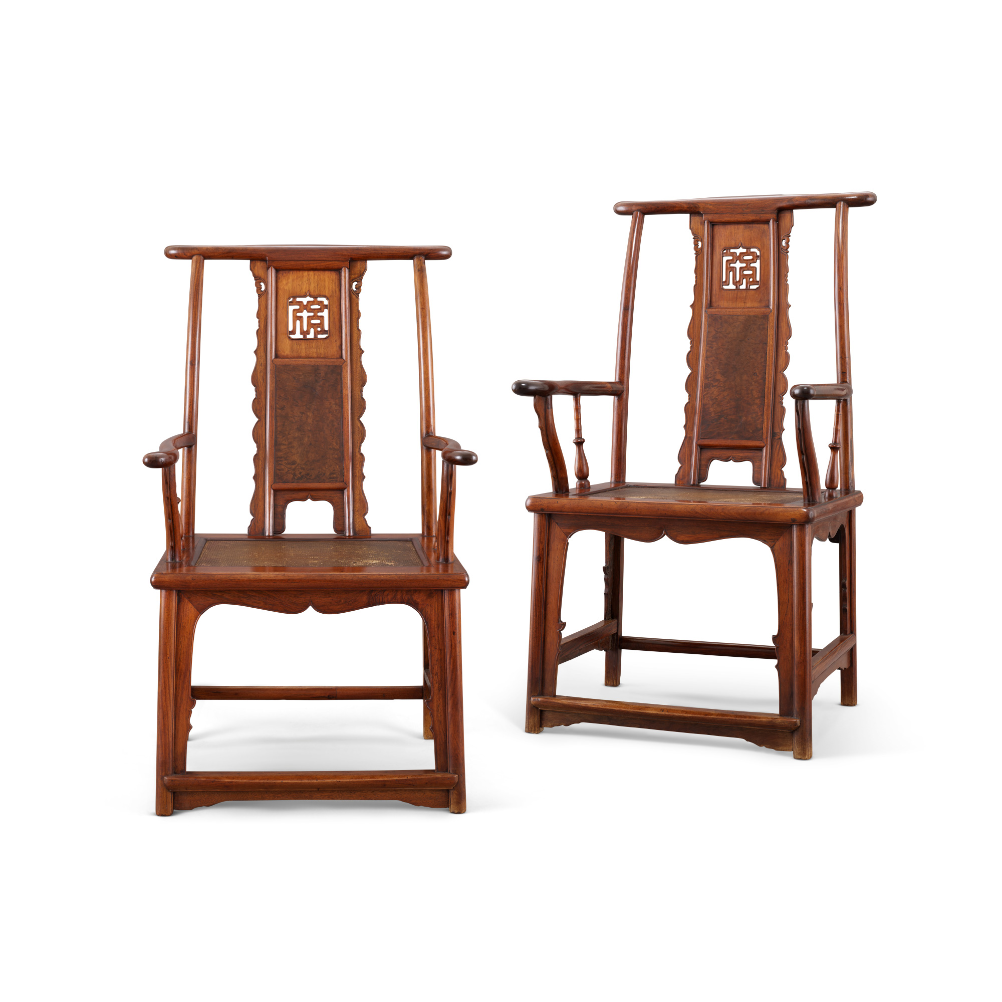 A rare pair of huanghuali and burlwood ‘fu’ character yokeback armchairs, sichutouguanmaoyi.16th-17th century. 46 1/4 in (117.5 cm) high, 25 1/4 in (64 cm) wide, 19 in (48.5 cm) deep. Estimates: HK$4,800,000-7,000,000. Offered in Important Chinese Ceramics and Works of Art on 2 May 2025 at Christie’s in Hong Kong
