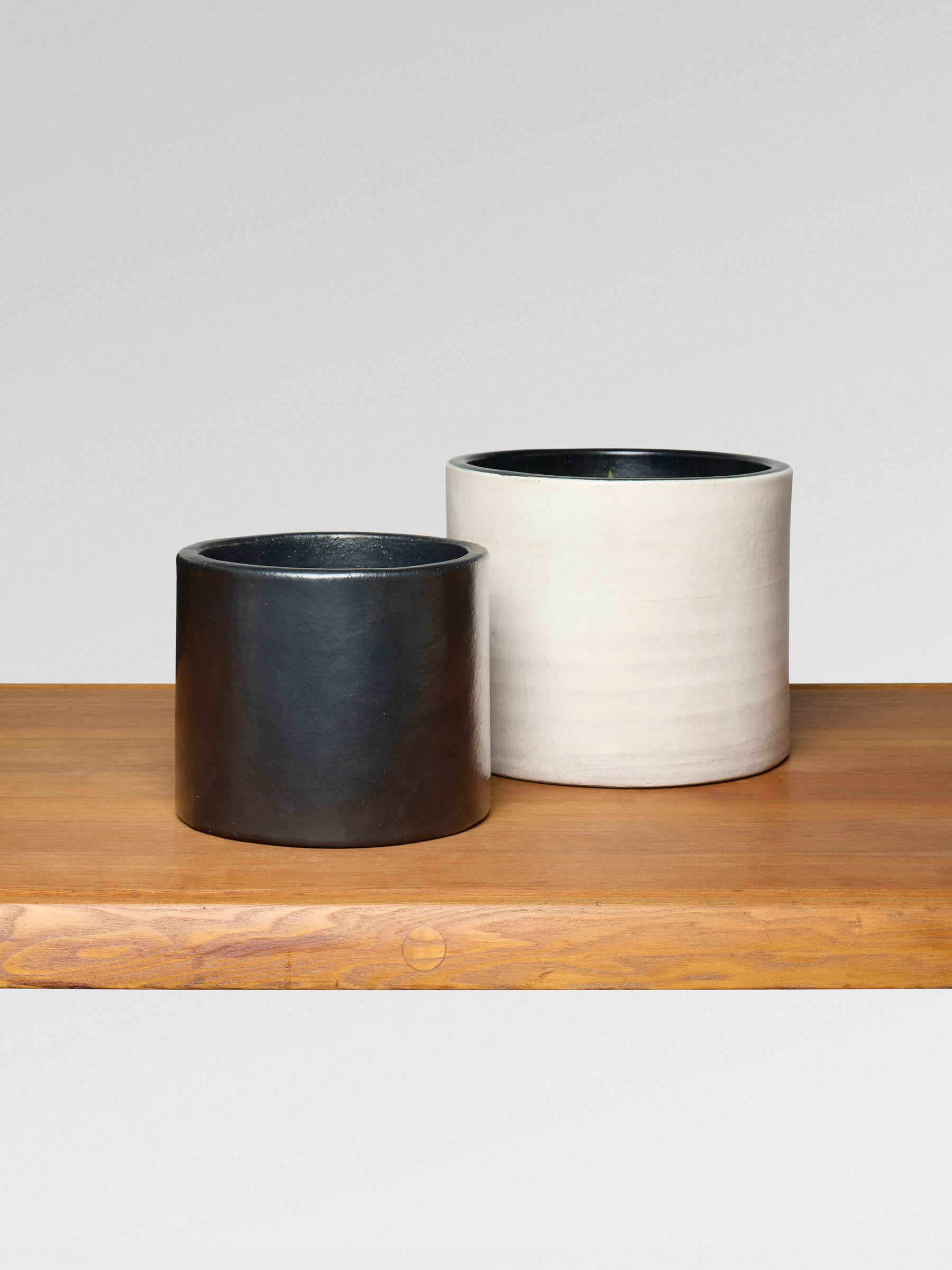 Left: Atelier Jouve, Cylindre, circa 1964-68, right: Georges Jouve, Cylindre, circa 1955, both offered in Design on 21 May 2025 at Christie's in Paris