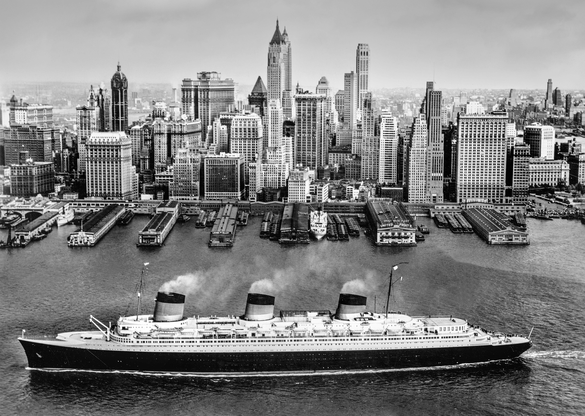 The SS Normandie on the Hudson River, with Lower Manhattan in the background, 1936