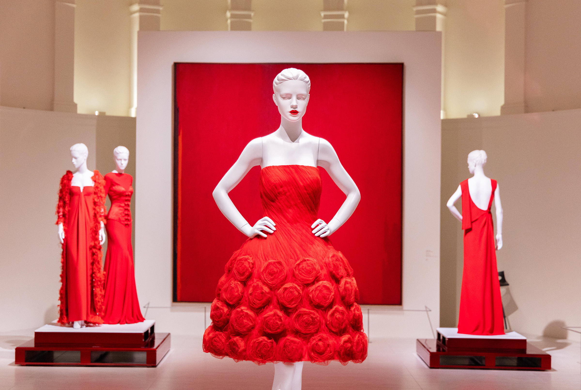 The exhibition places couture pieces from throughout Valentino’s career in dialogue with works of modern and contemporary art. Partially visible above is Clyfford Still, 1955-D, PH-387, 1955
