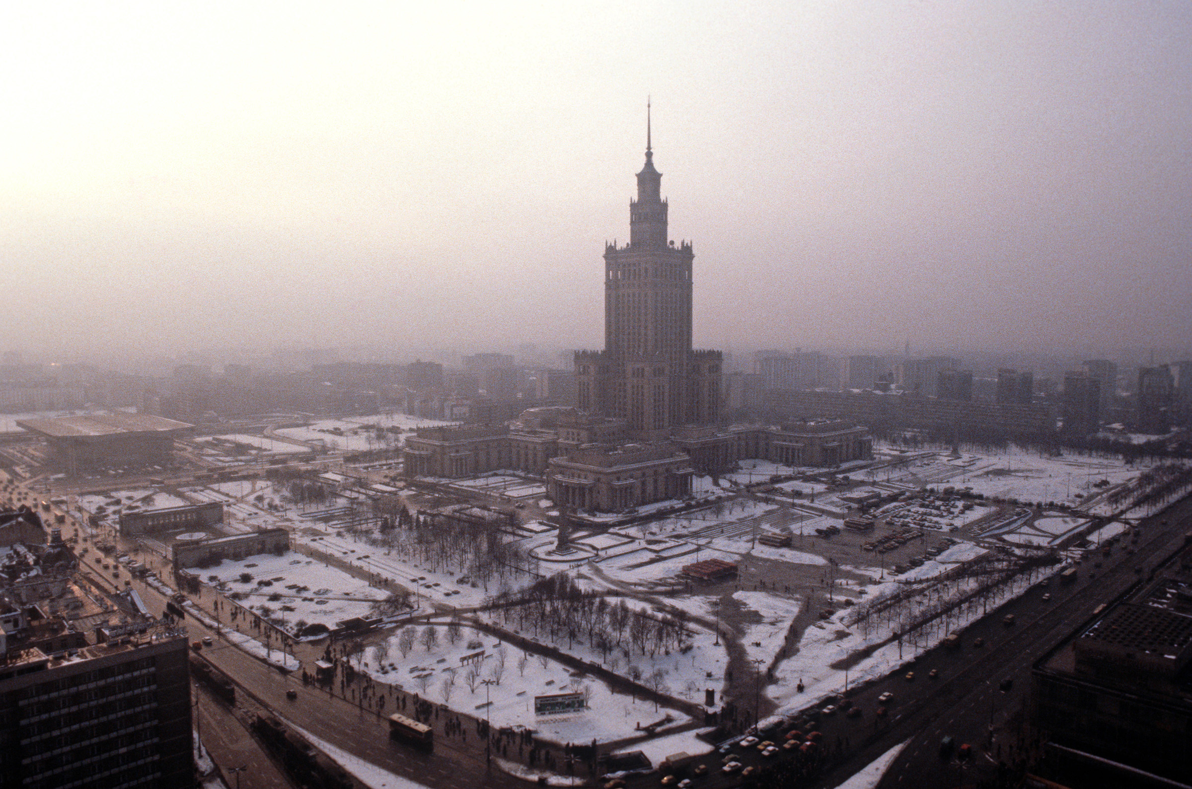 The Palace of Culture and Science, Warsaw, in 1979. Graham Greene, in a 1956 essay on Warsaw for The Atlantic magazine, describes how the edifice 'shoots up its useless tiers like a gangster's wedding cake in the centre of the city'