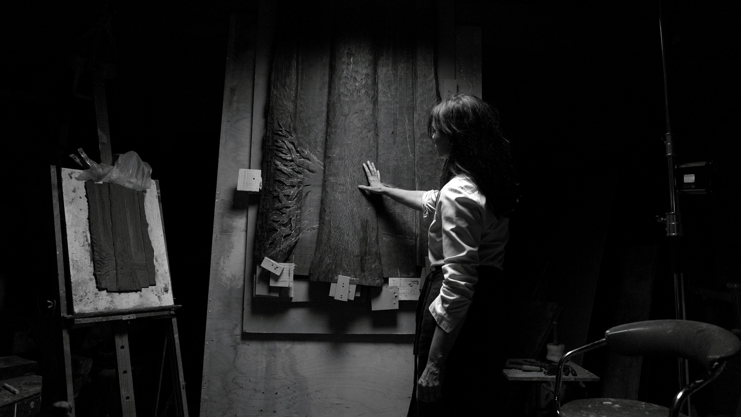 Wightman with her bas-relief work Forest Cathedral, on view at Christie's in London, 18-22 October, and its maquette. The work is carved from five planks of bog oak recovered from the legendary Hemplands Haul