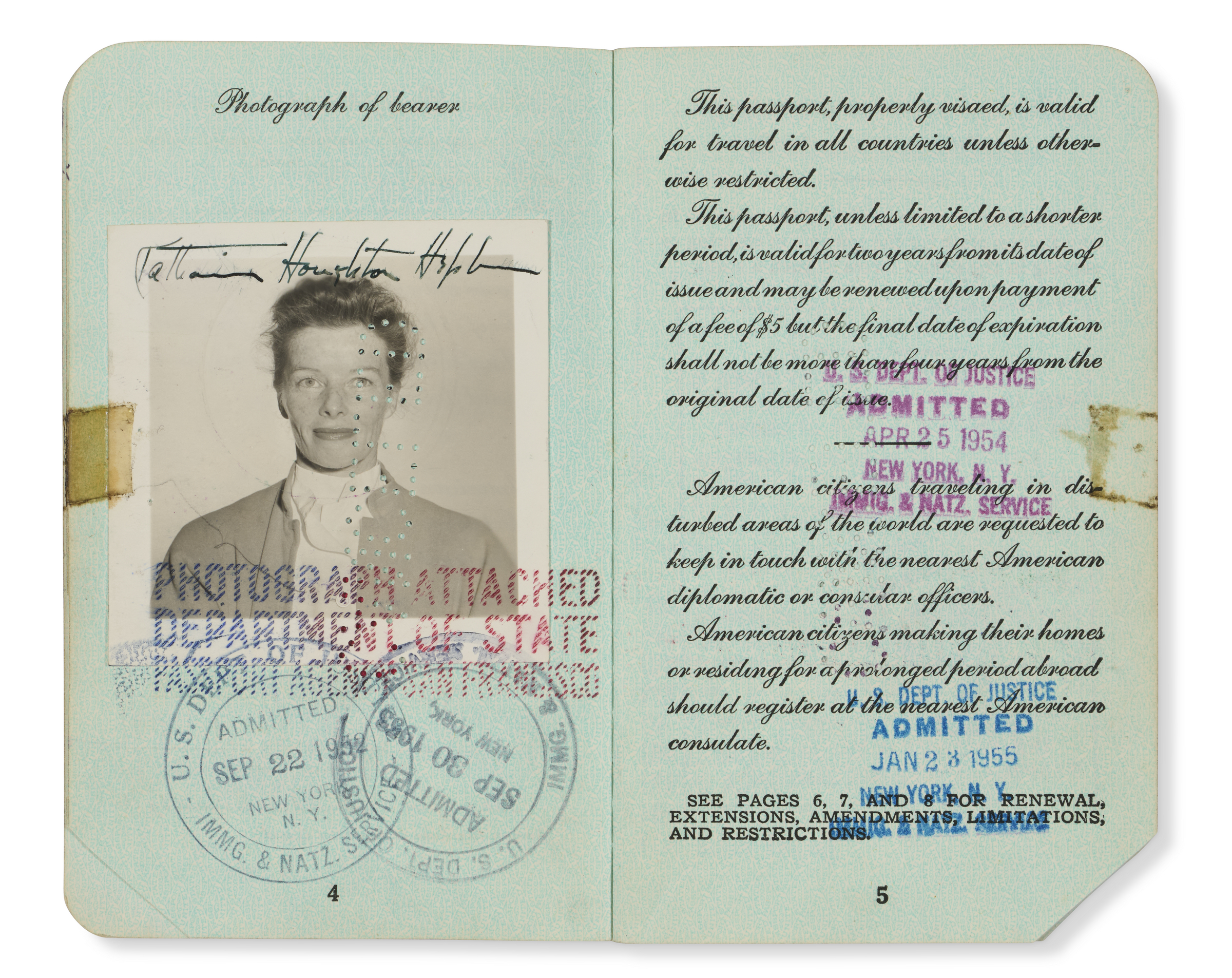An open vintage passport showing a page with a photograph and travel stamps, and another page with text about passport validity and regulations.