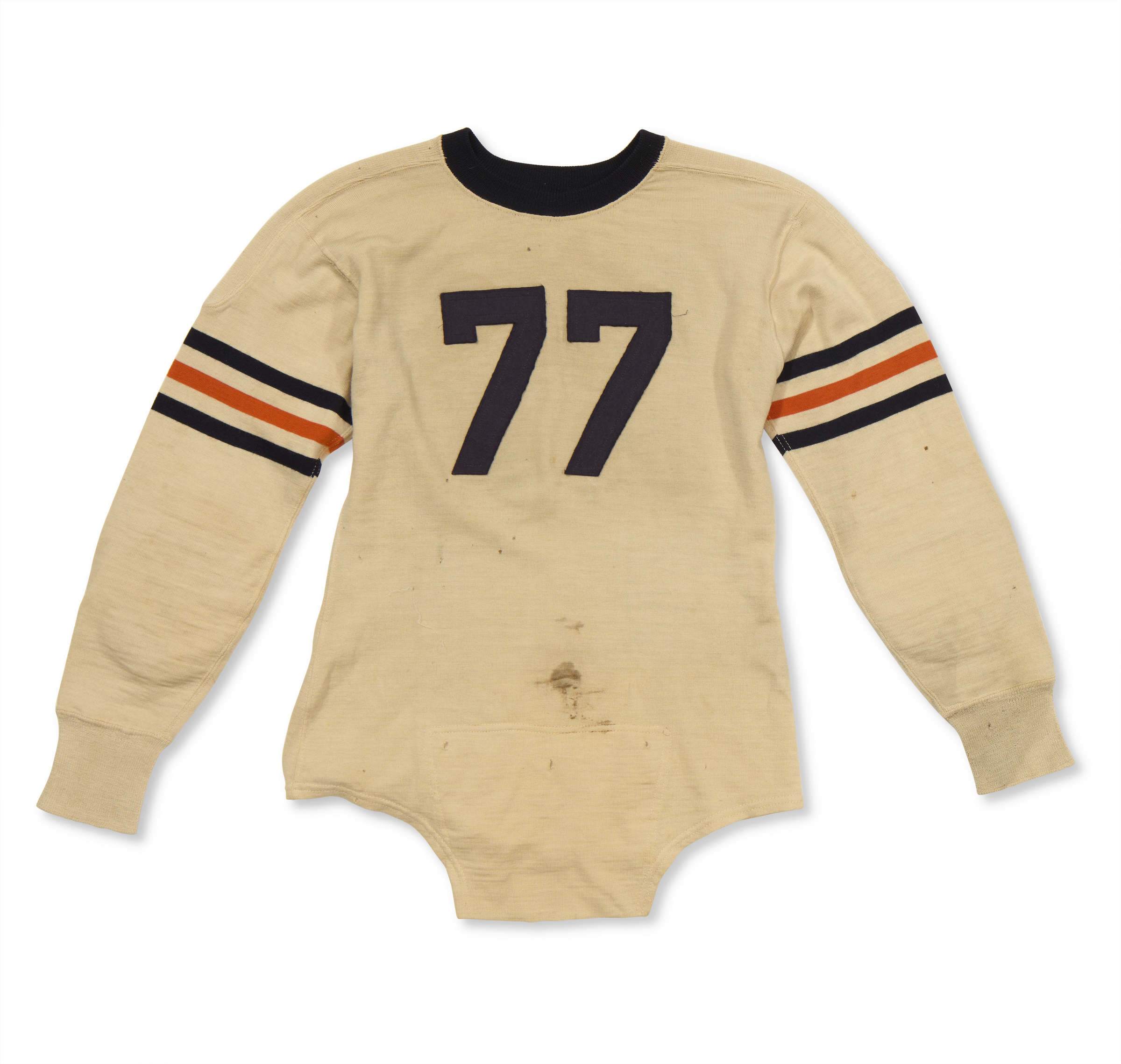 An old, worn hockey jersey with the number 77, featuring black and orange stripes on the sleeves.