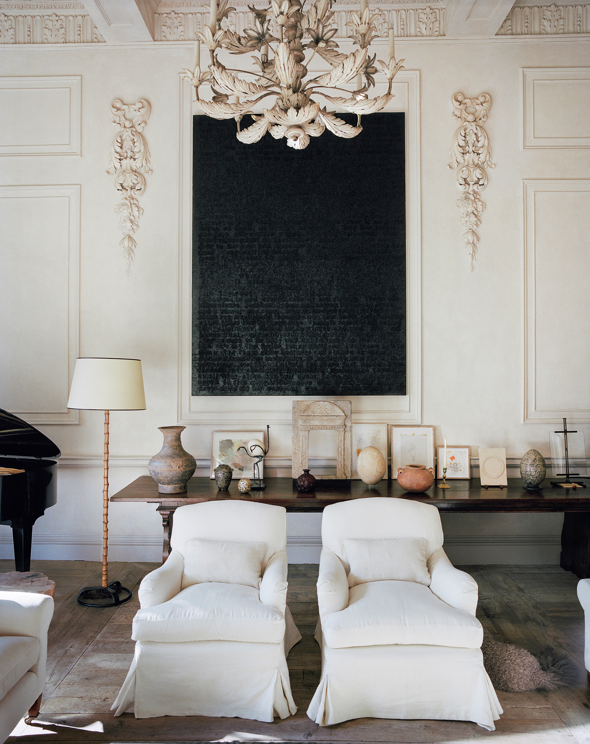 'The drawing room started with my childhood piano,' says Uniacke. On the refectory table beneath a work by Glenn Ligon, 'a 15th-century marble tabernacle sits surrounded by various treasures: pre-dynastic vessels, a large Warring States Chinese urn, a piece of Lalique glass'. There are other riches overhead: 'Wonderful, intricate plasterwork on the cornice and ceiling, so elegant and peaceful with no highlights. The light and shadow do it all'