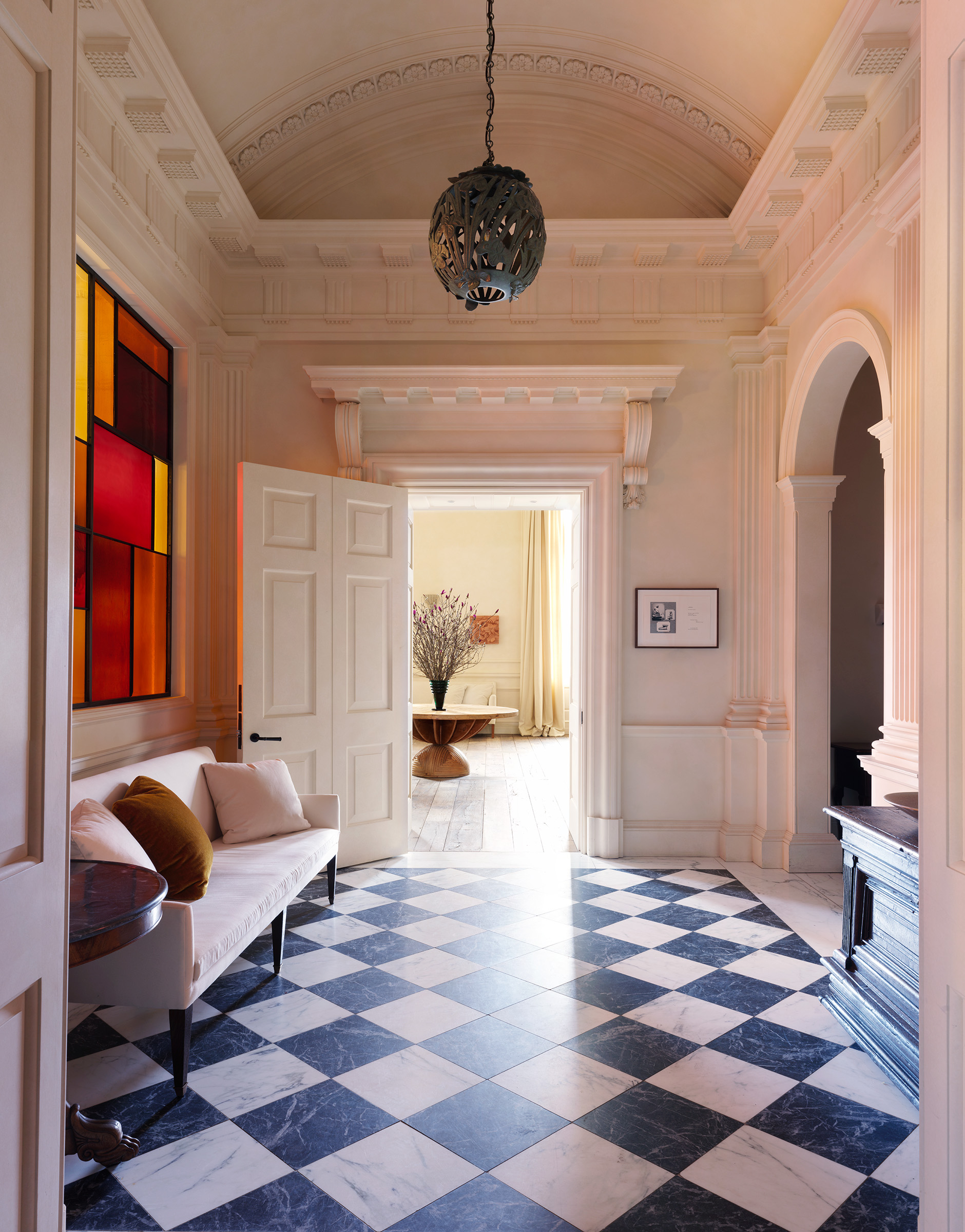 The hallway at New York City's San Vicente West Village members' club, which features a bespoke stained-glass window. 'I worked with a San Francisco glazier on this and I'm thrilled with the result,' says Uniacke. 'I wanted to create something modern and exciting while also making a nod to a past tradition'