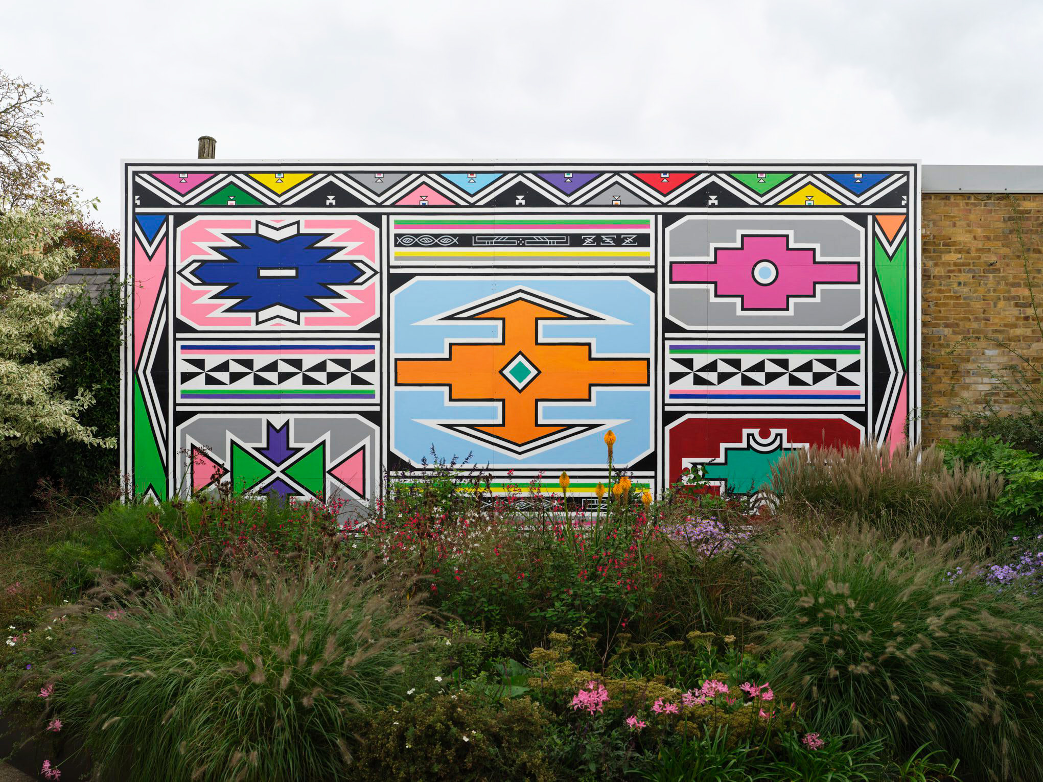Esther Mahlangu's installation Umuntu ngumuntu ngabantu, 2024, in the Serpentine North Garden in Hyde Park, London, 2024-25. The title of the work translates from Ndebele as 'I am because you are'